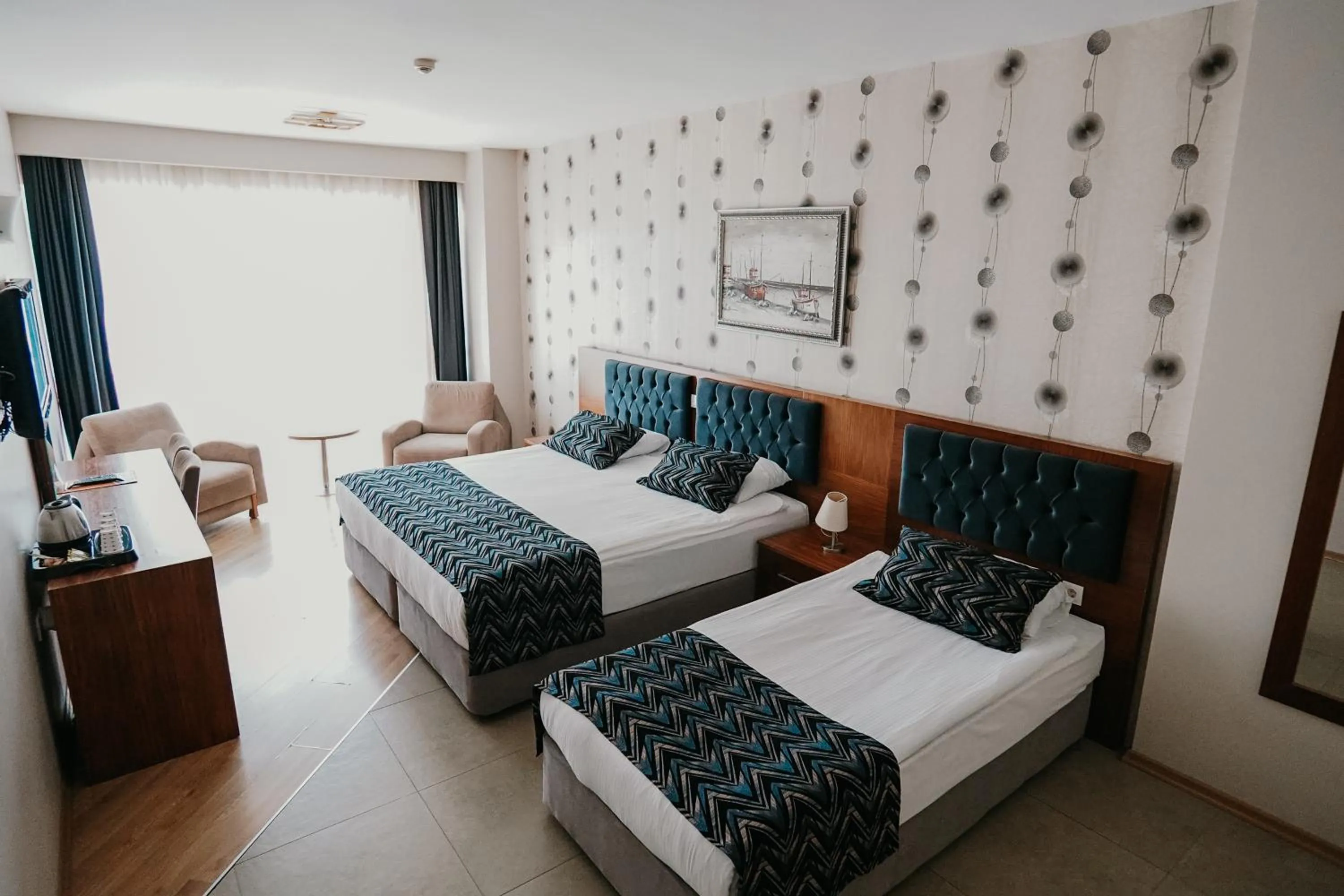 Communal lounge/ TV room, Bed in Grand Karot Hotel