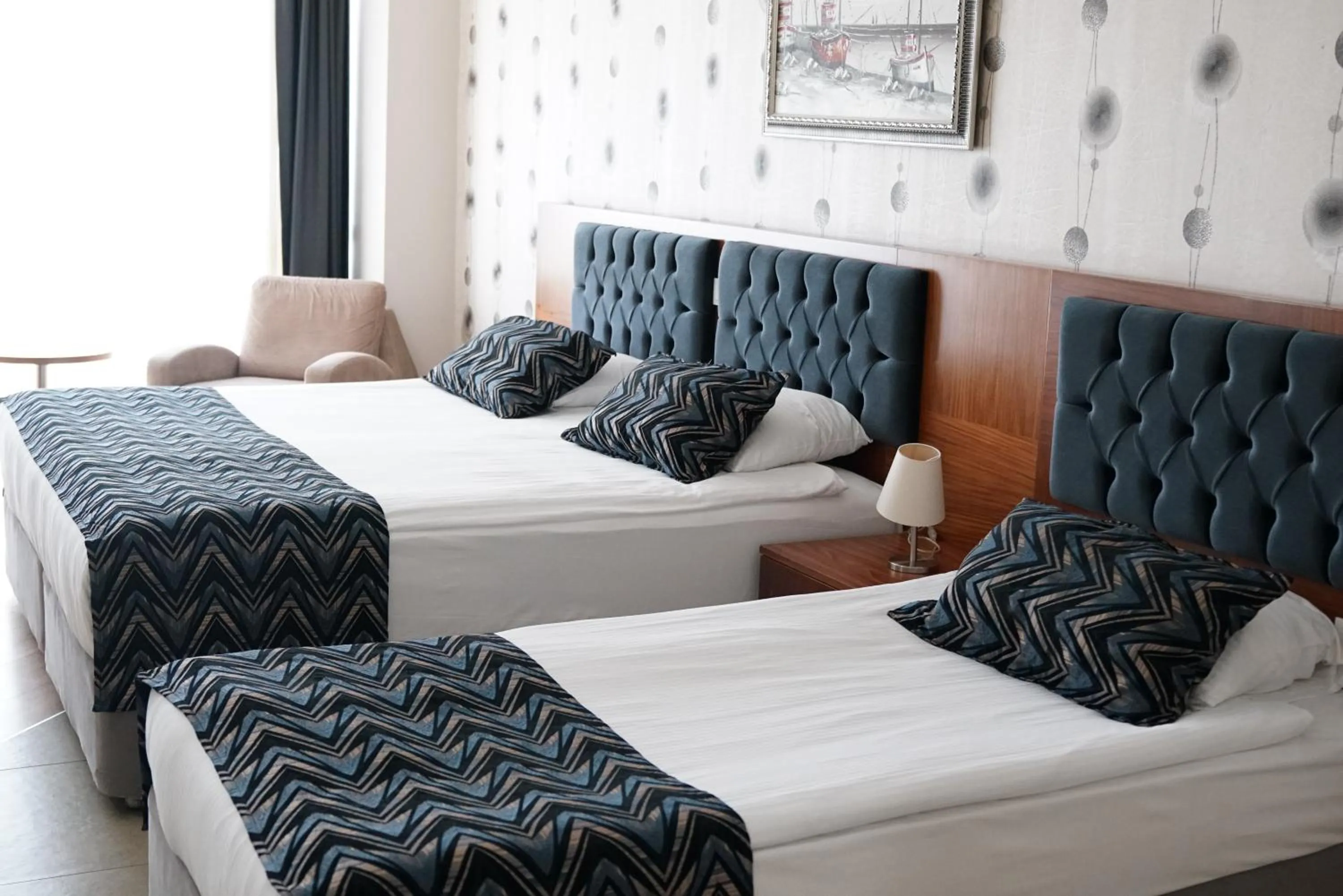 Communal lounge/ TV room, Bed in Grand Karot Hotel