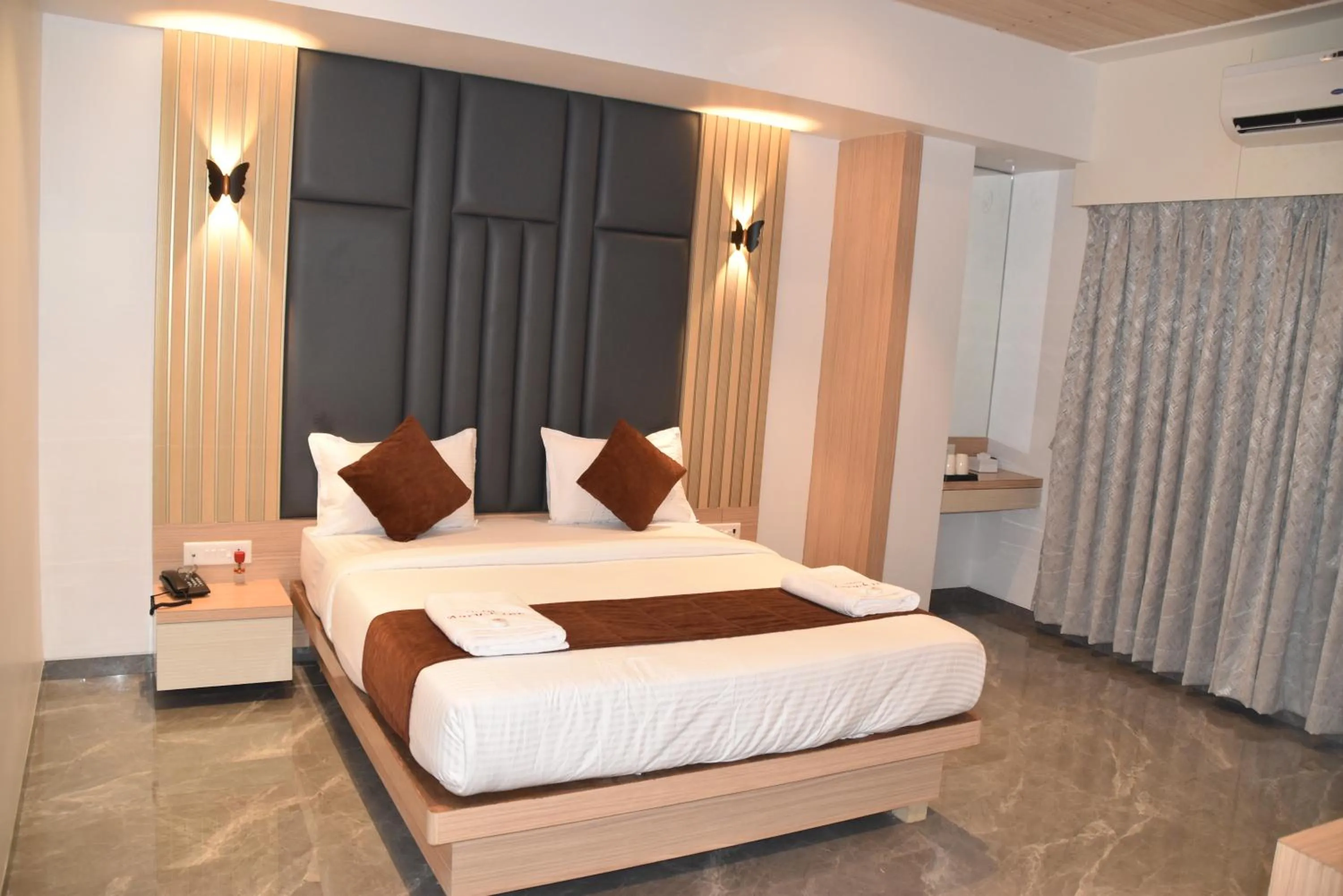 Bed in Hotel Aarush Inn