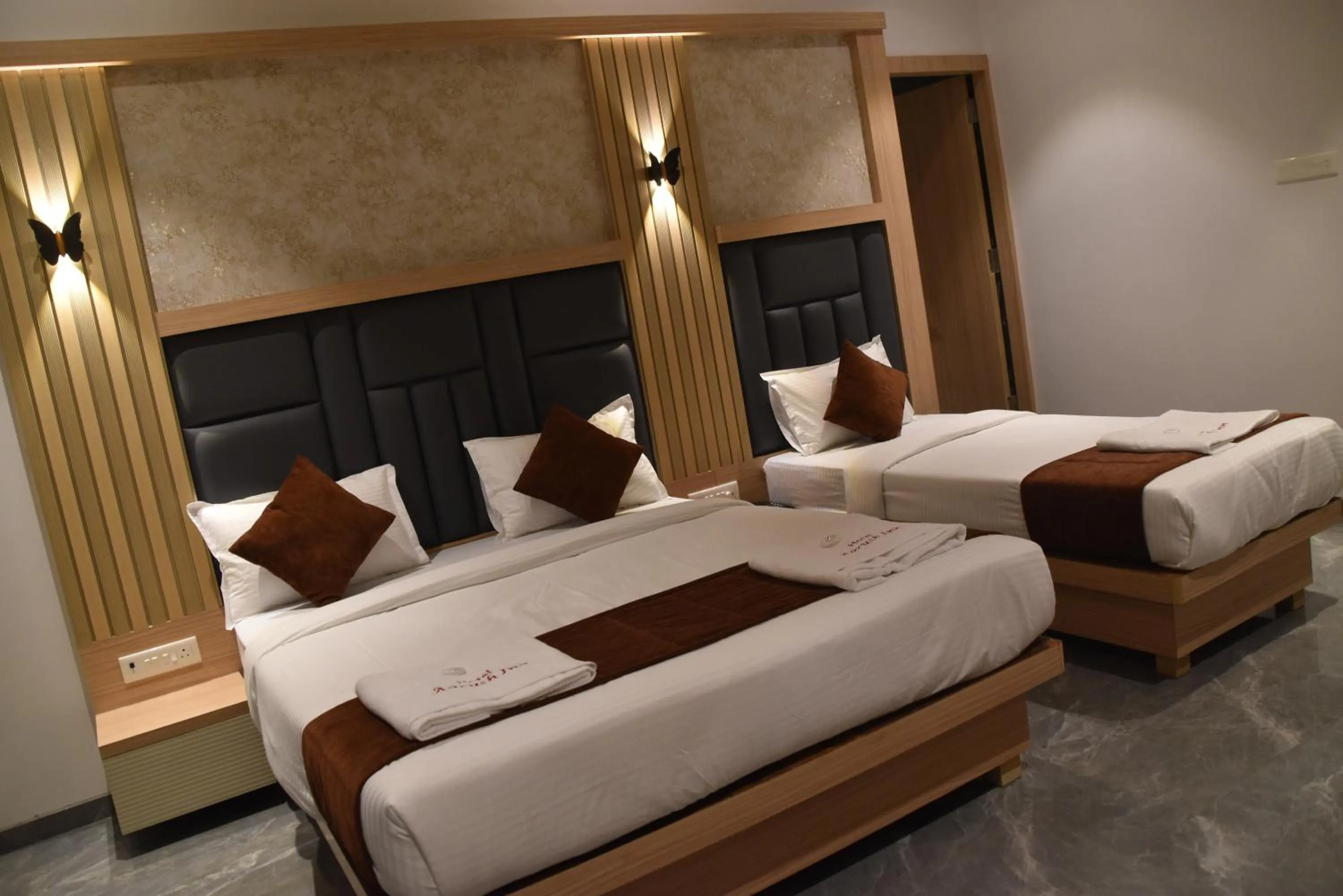 Bed in Hotel Aarush Inn