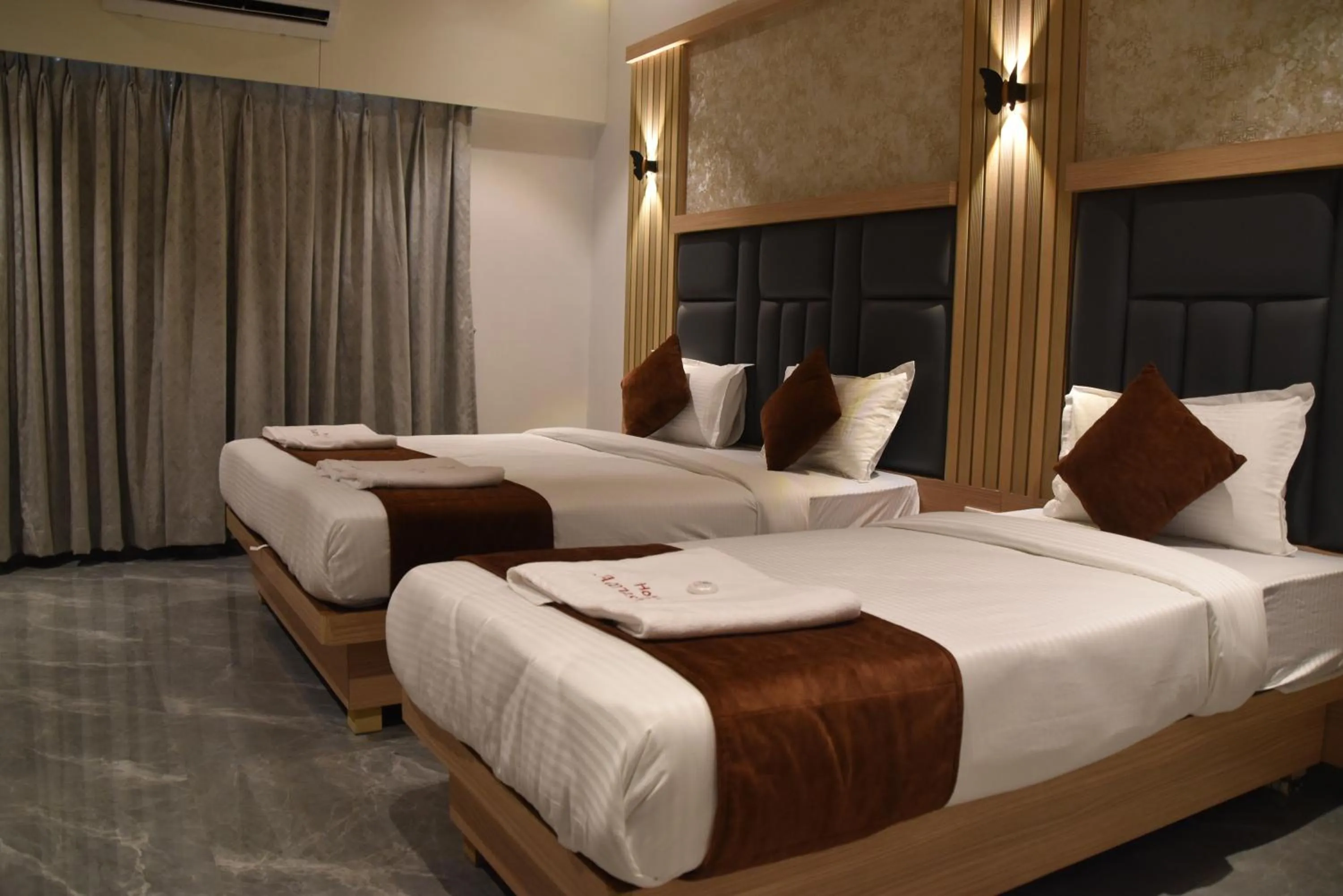 Bed in Hotel Aarush Inn