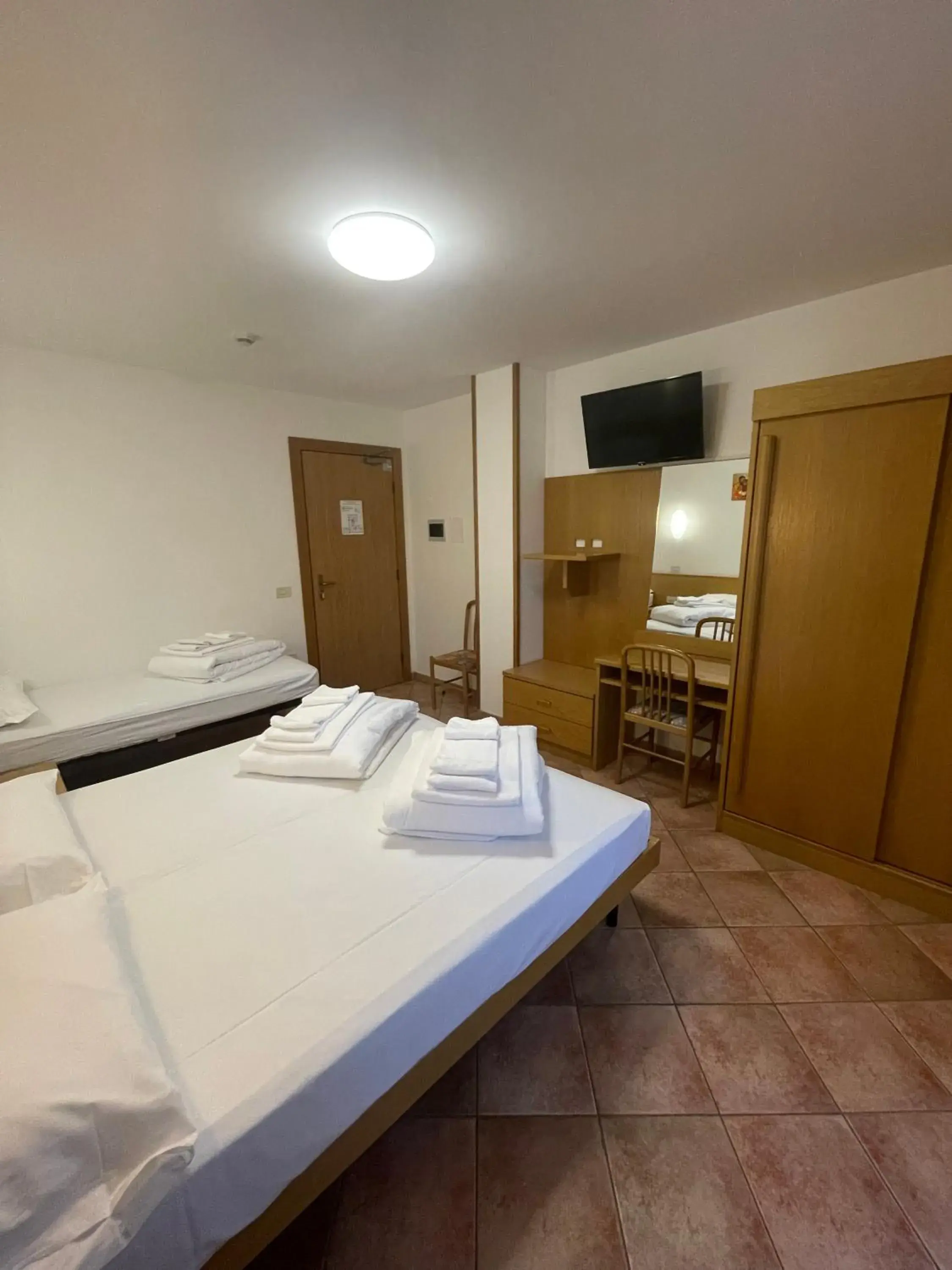 Classic Triple Room in Casa Santa Maria Classic Triple Room in Casa Santa Maria