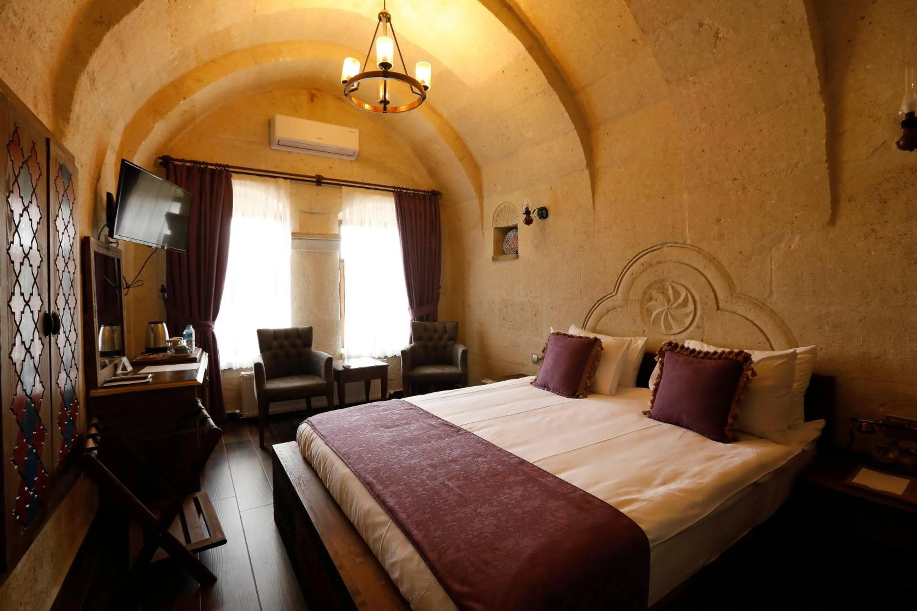 Bed in Ada Cave Suites