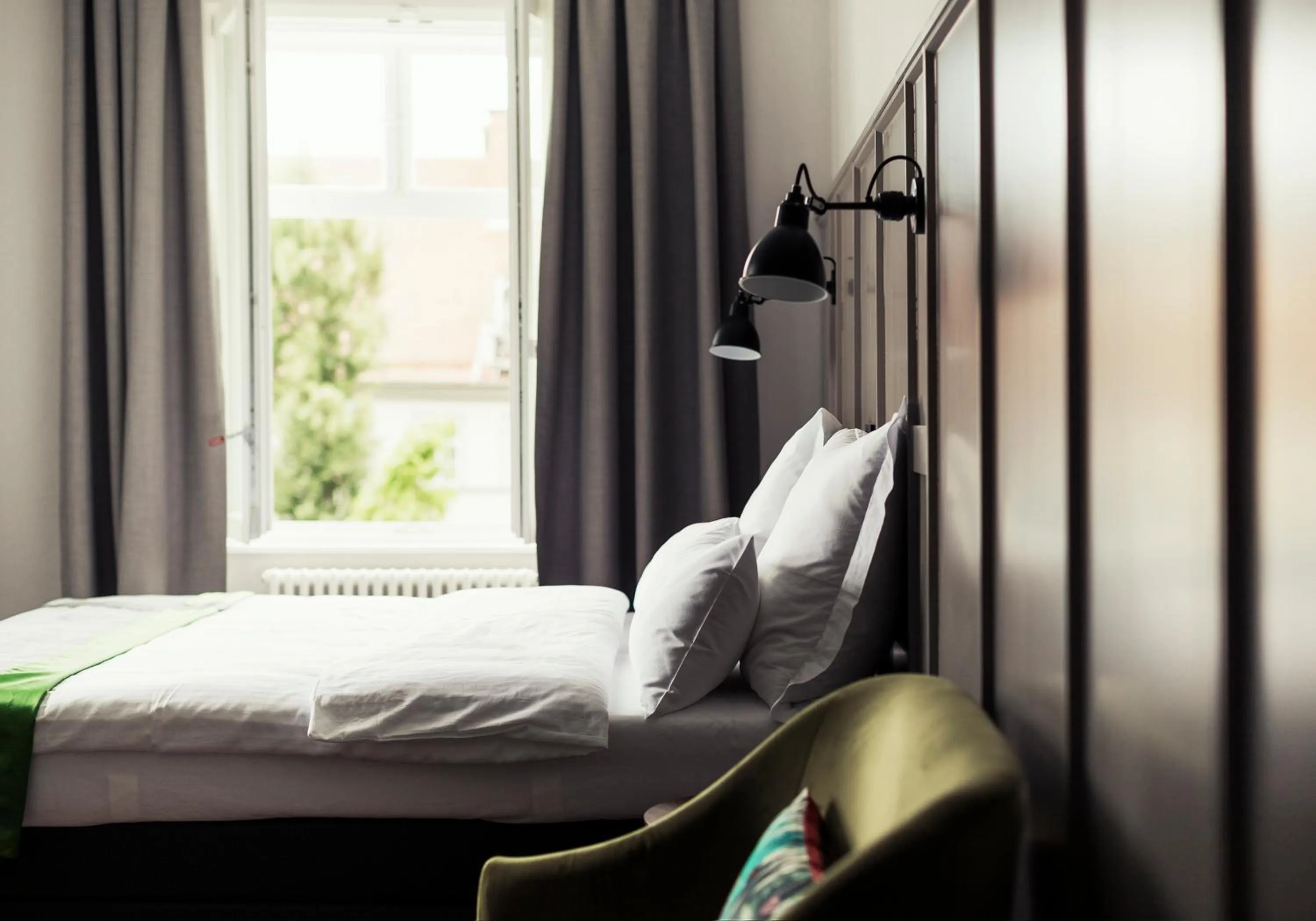 Bed in Kollmann Rooms and Apartments