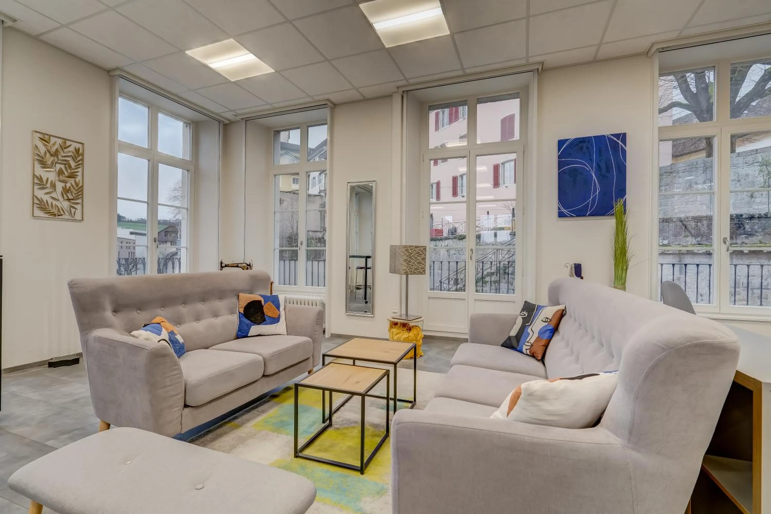 Living room in The 5 Continents I by Stay Swiss