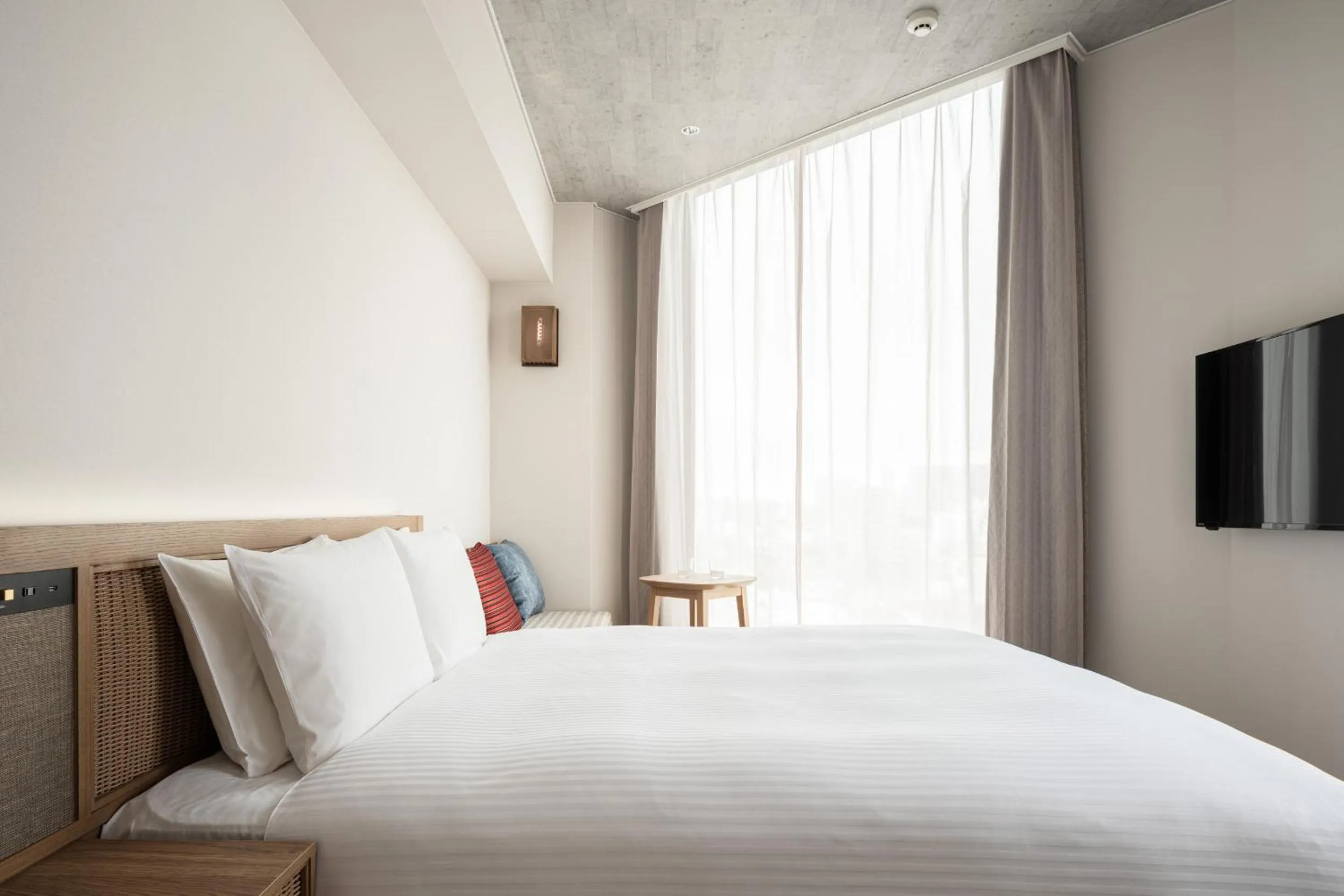 Photo of the whole room, Bed in Nest Hotel Naha Kumoji
