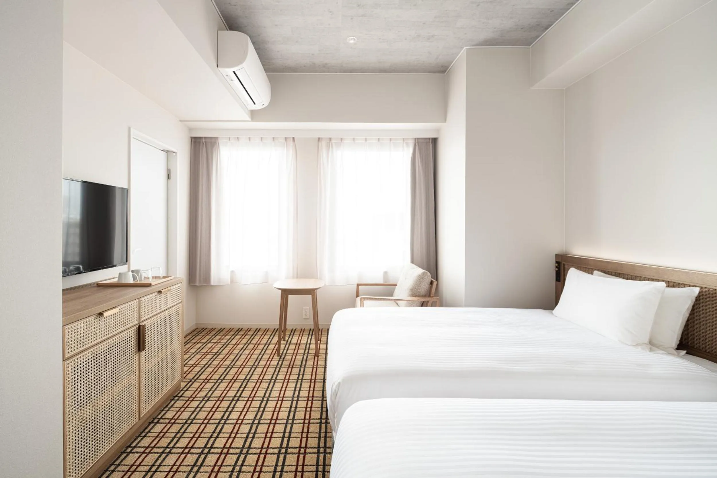 Photo of the whole room, Bed in Nest Hotel Naha Kumoji