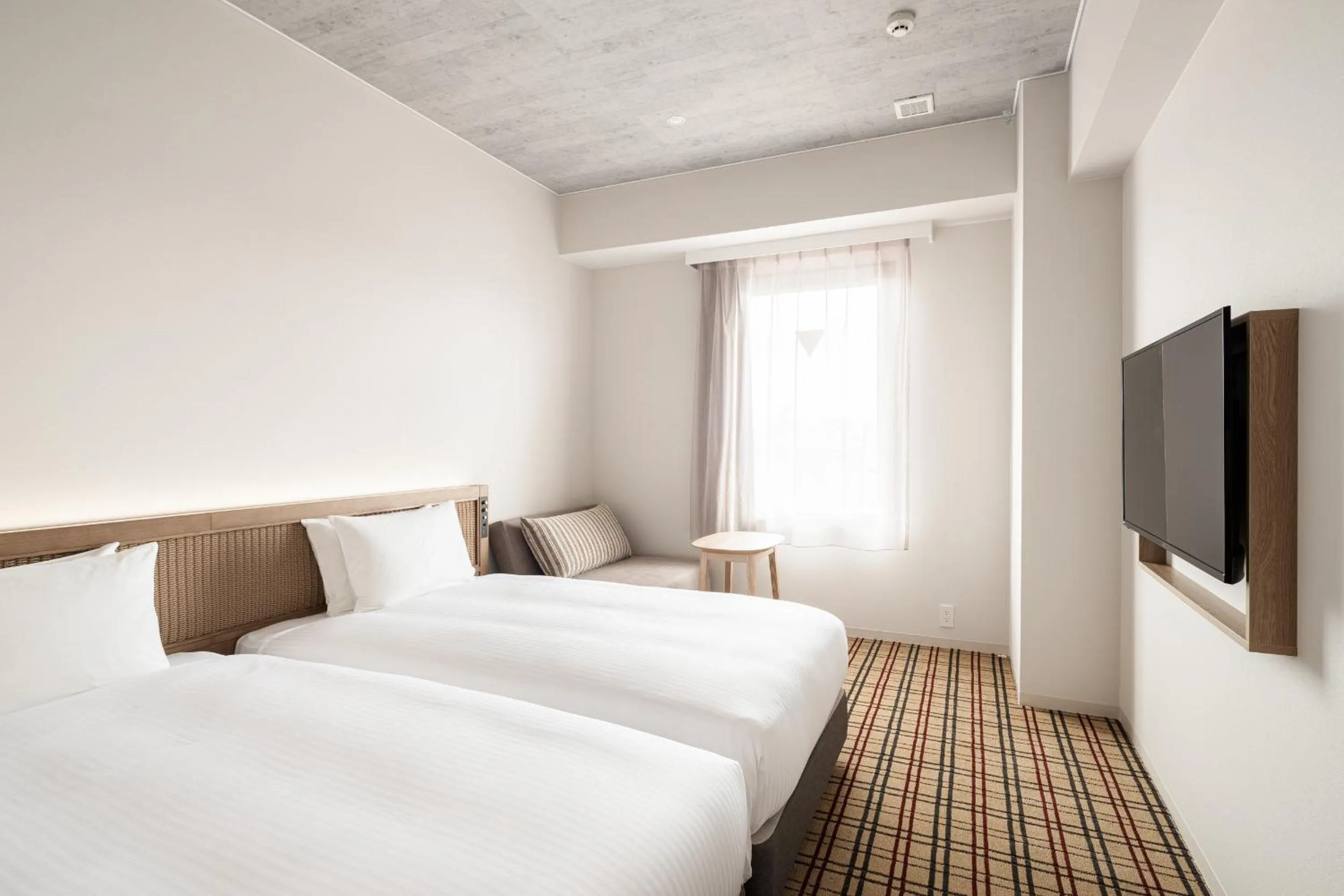 Photo of the whole room, Bed in Nest Hotel Naha Kumoji