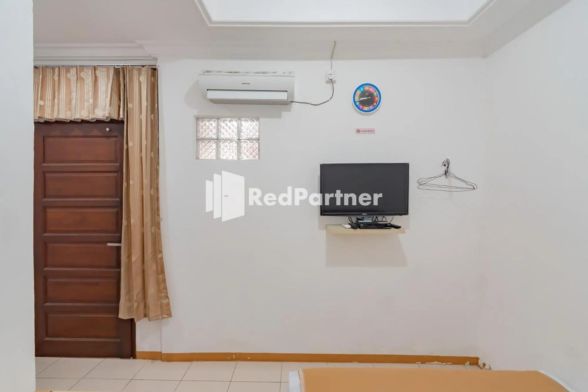 Bedroom in Langkar Guest House Syariah Mitra RedDoorz