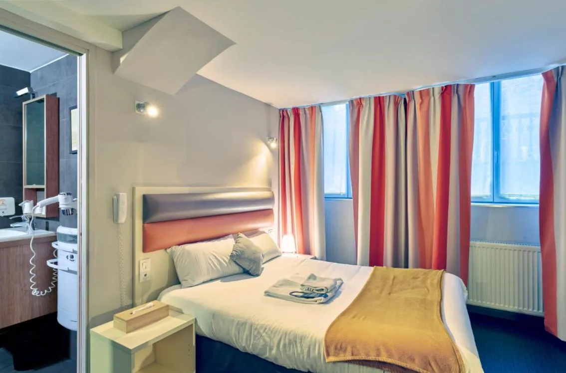 Bed in Adonis Hotel Strasbourg