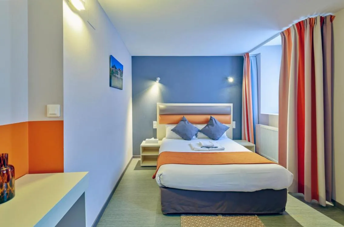 Bed in Adonis Hotel Strasbourg