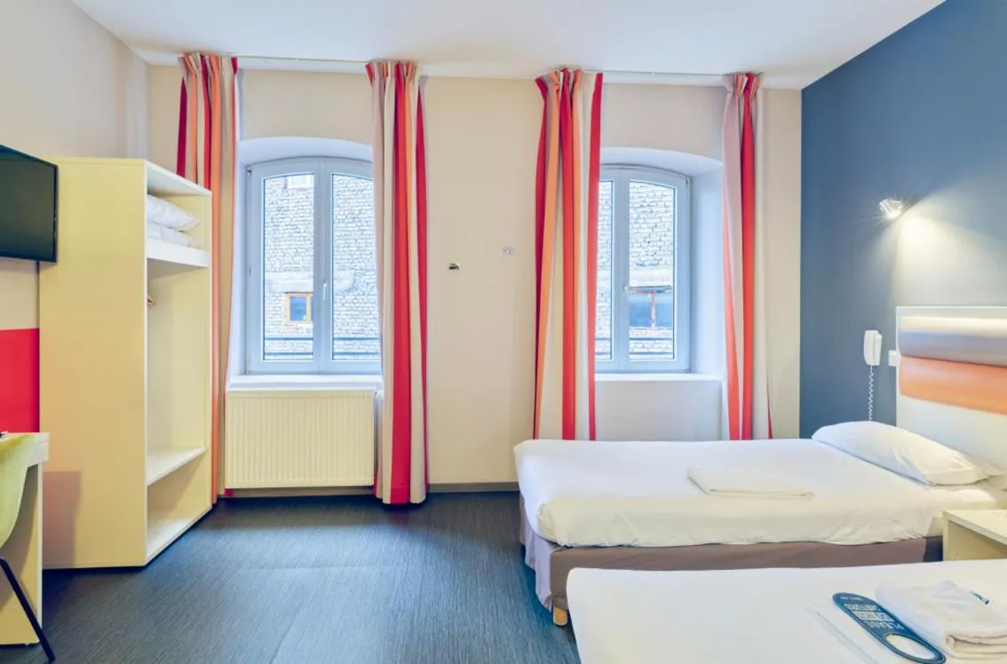 Bed in Adonis Hotel Strasbourg