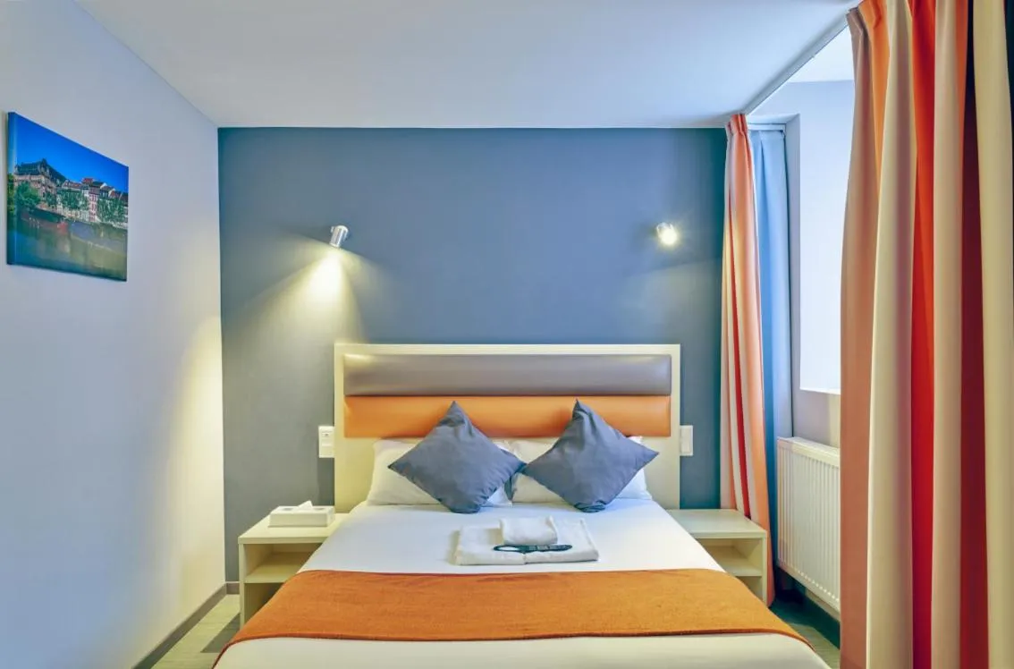 Photo of the whole room, Bed in Adonis Hotel Strasbourg