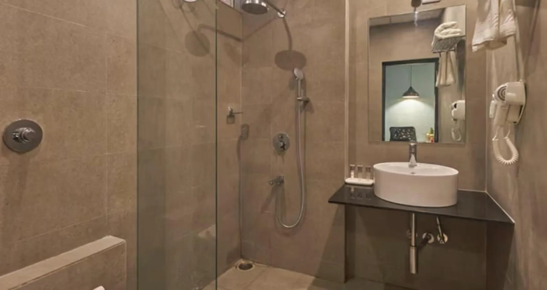 Bathroom in Regenta INN Grand Koramangala by Royal Orchid Hotels