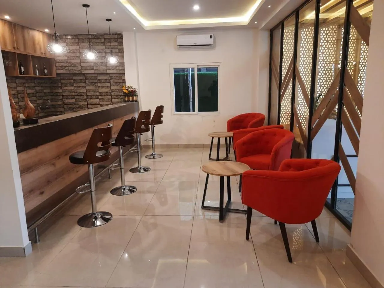 Seating area in Regenta INN Grand Koramangala by Royal Orchid Hotels