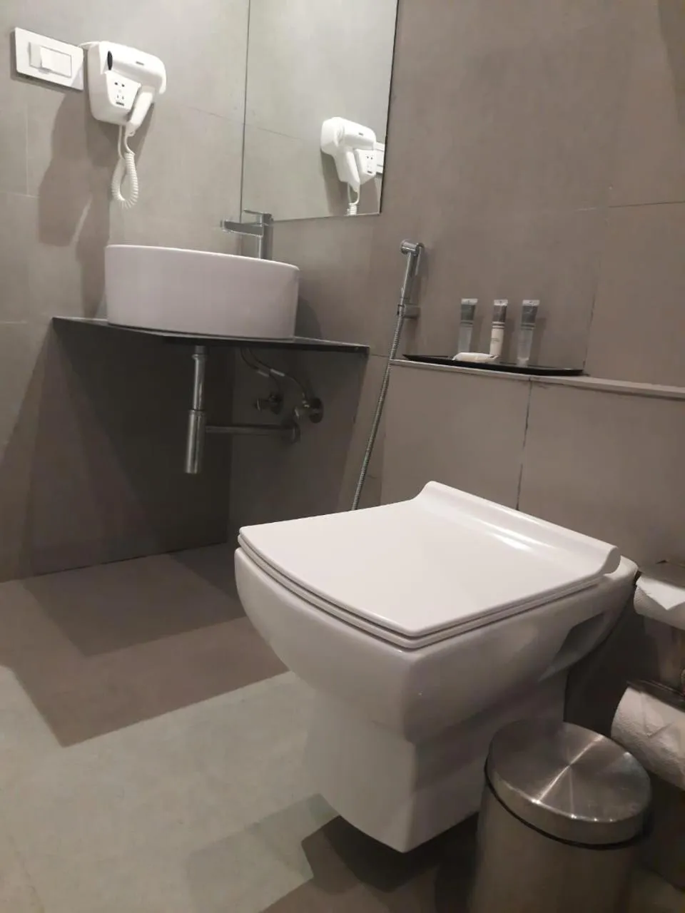 Toilet in Regenta INN Grand Koramangala by Royal Orchid Hotels