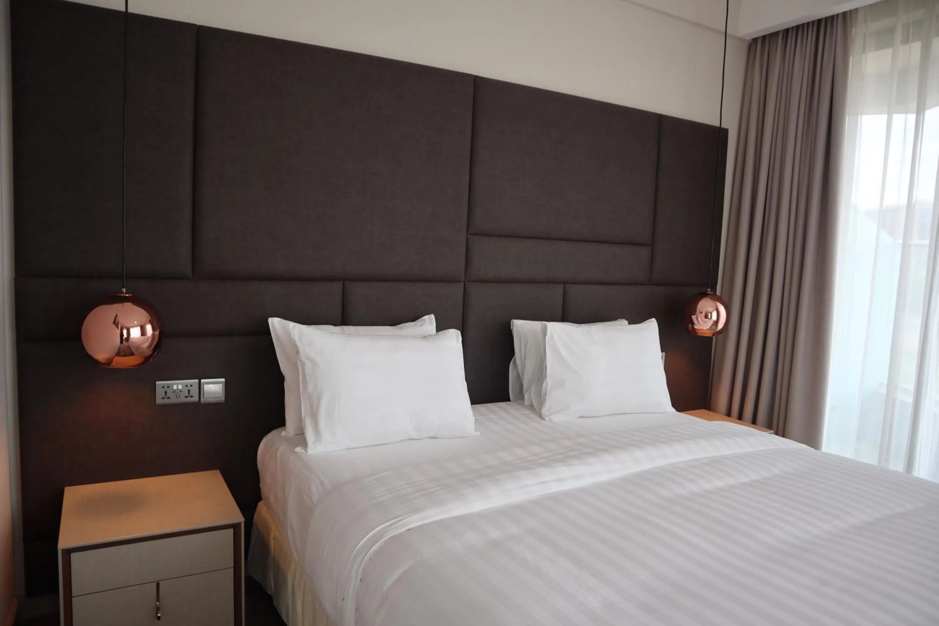 Bed in The Curve by the Park Apartments