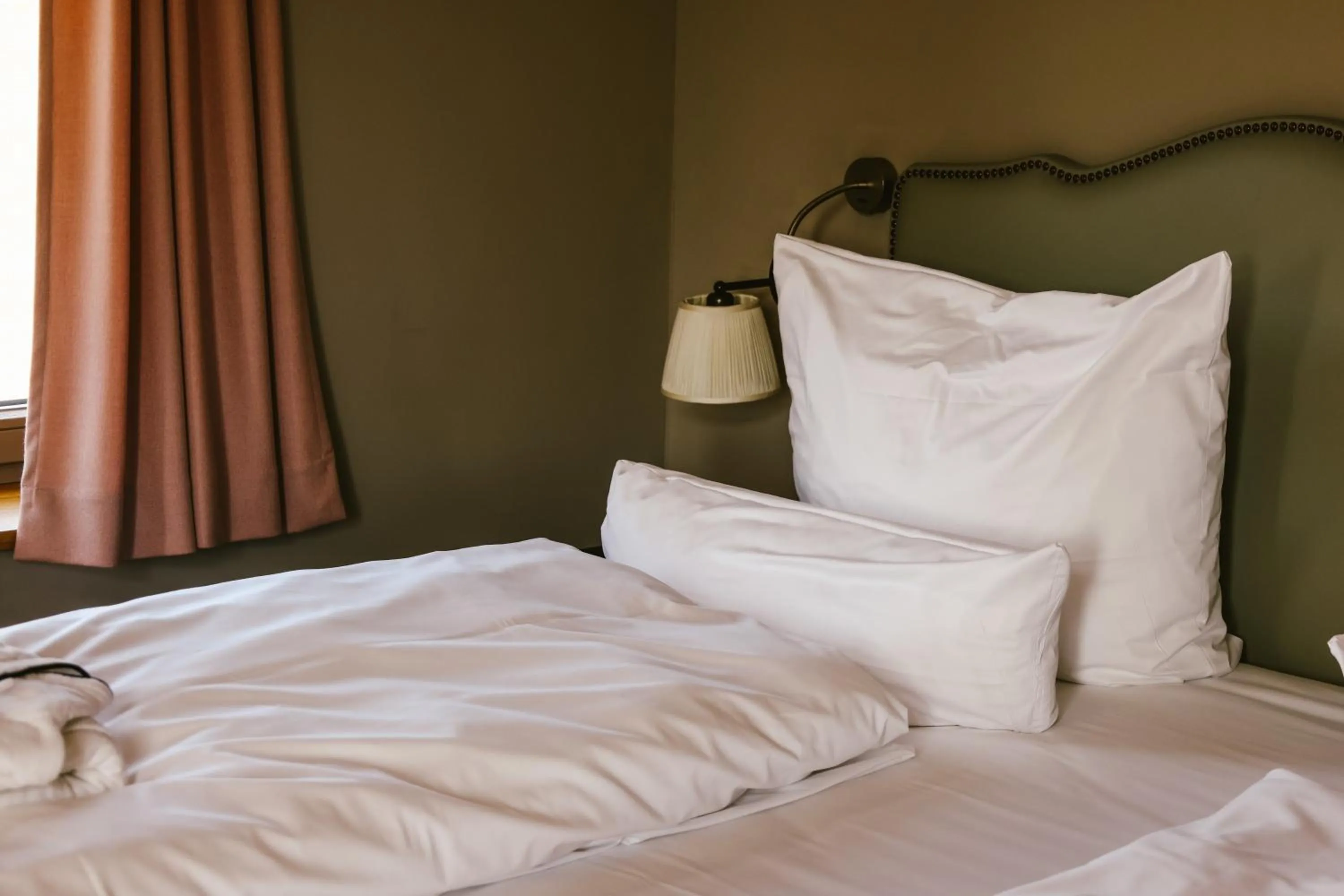 Bed in Mimosa Suites