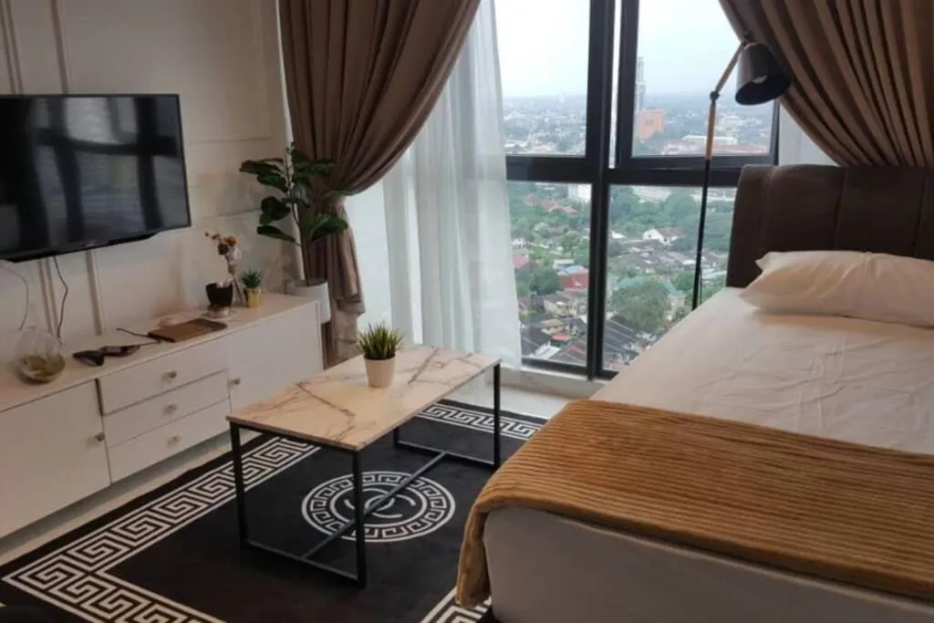 Bed in Mizrai Troika Homestay with Kota Bharu city view