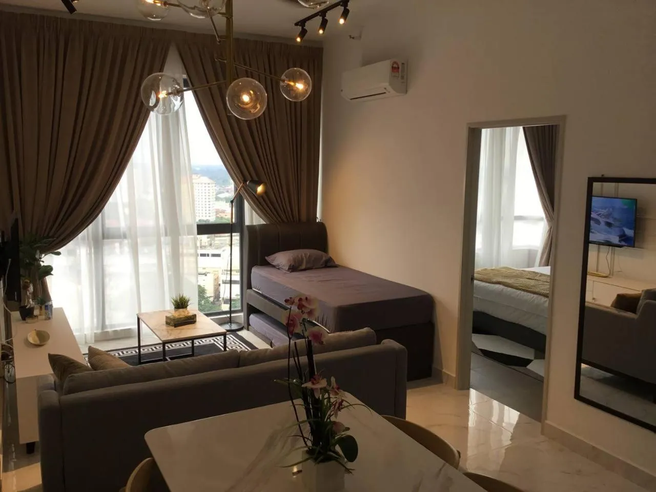 Living room, Bed in Mizrai Troika Homestay with Kota Bharu city view