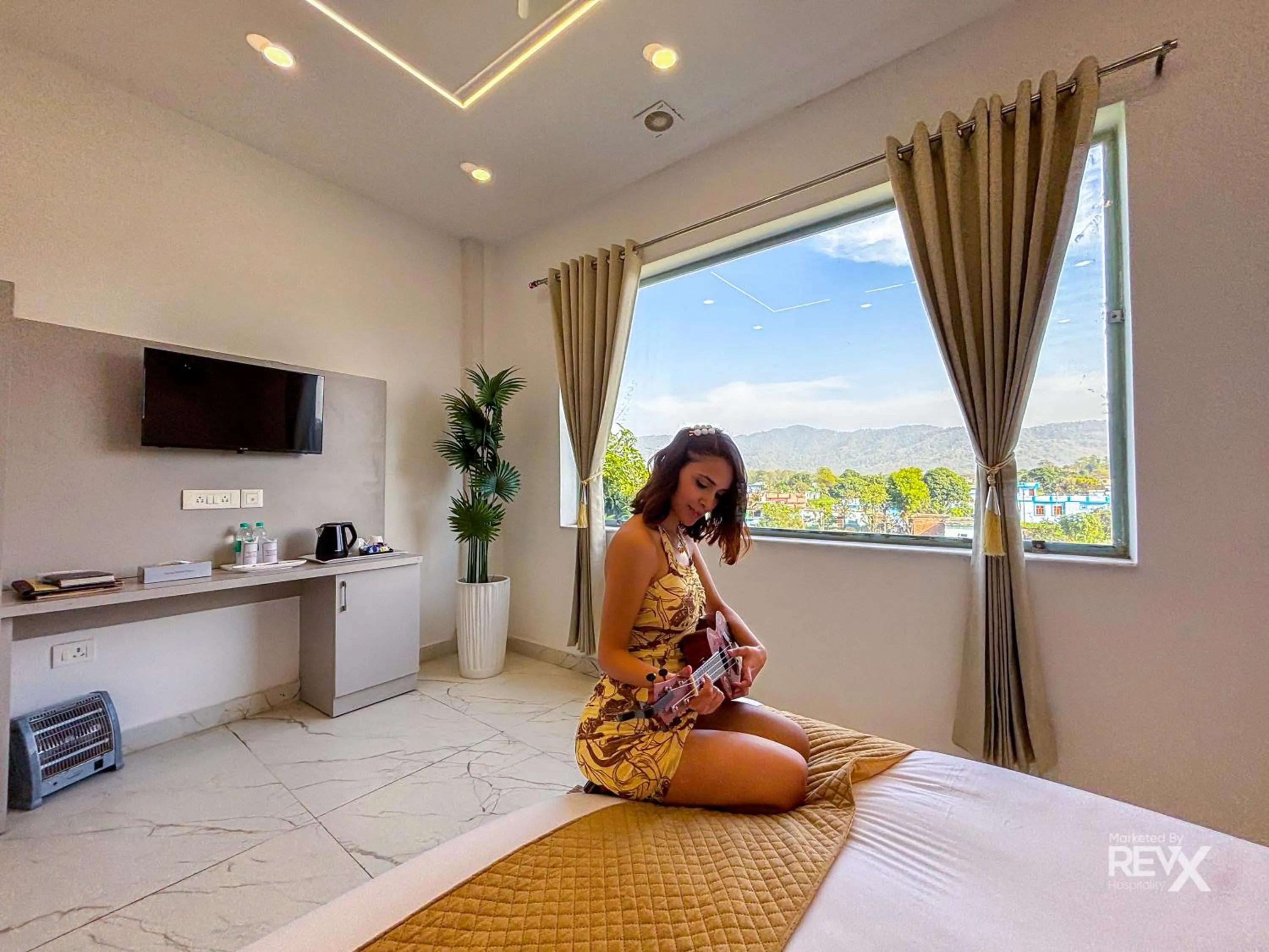 Bed in The Neeraj River Forest Resort Ayurvedic Wellness Center