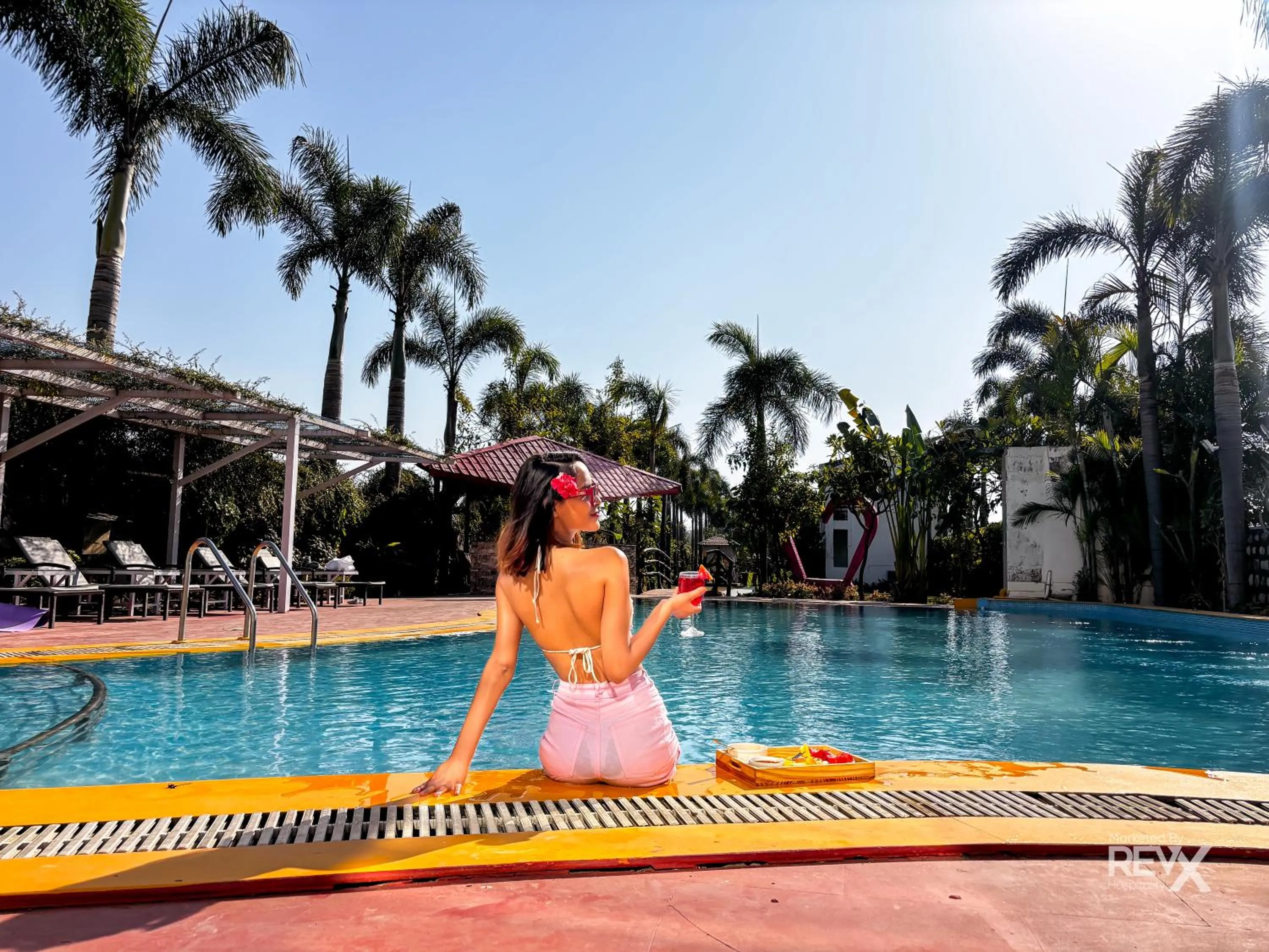 Swimming pool in The Neeraj River Forest Resort Ayurvedic Wellness Center
