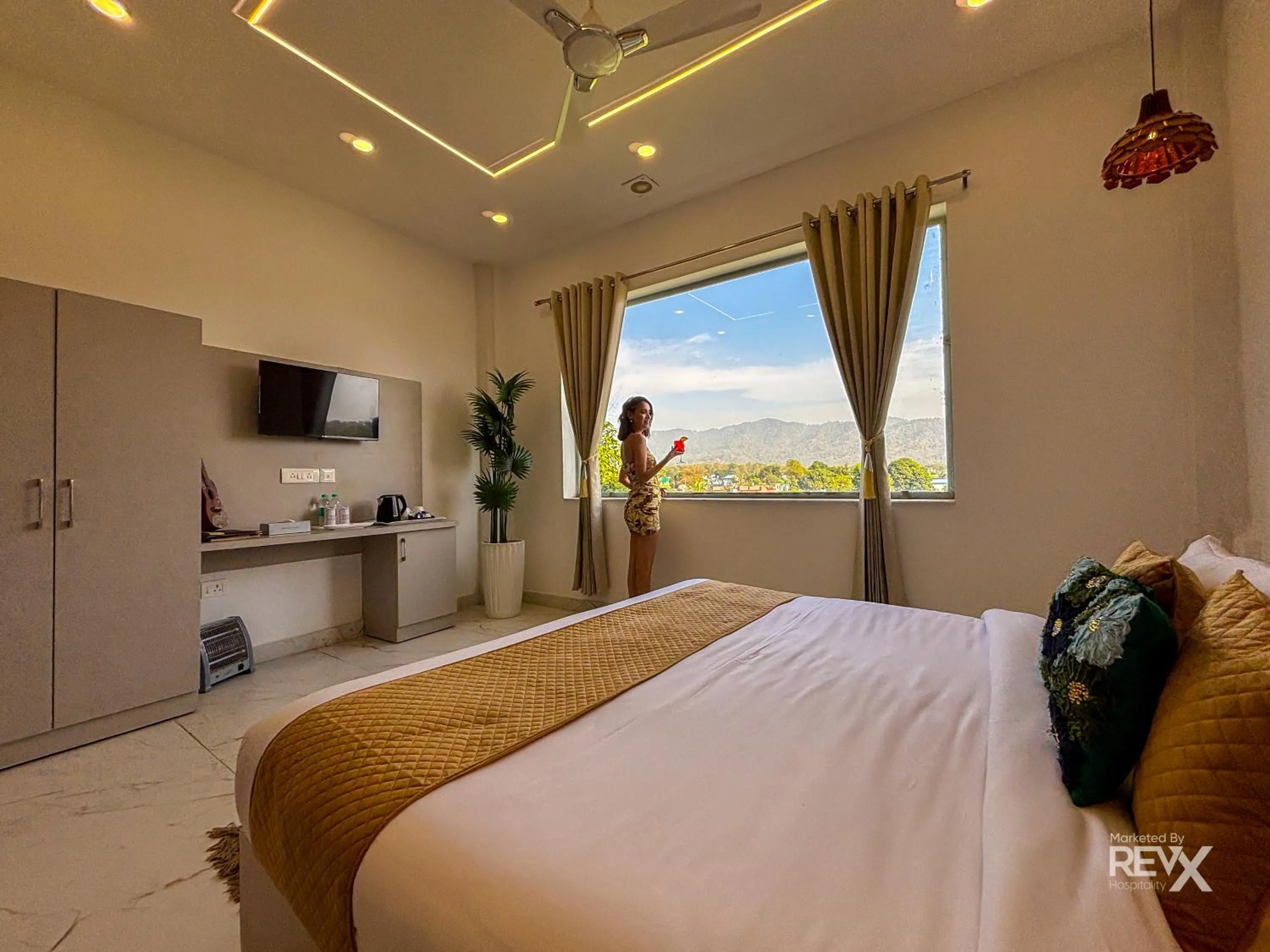 Bed in The Neeraj River Forest Resort Ayurvedic Wellness Center