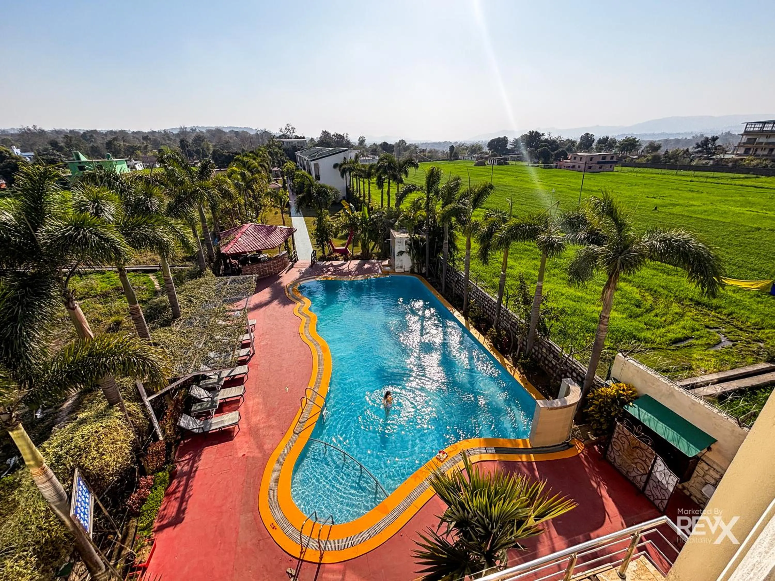 Swimming pool in The Neeraj River Forest Resort Ayurvedic Wellness Center