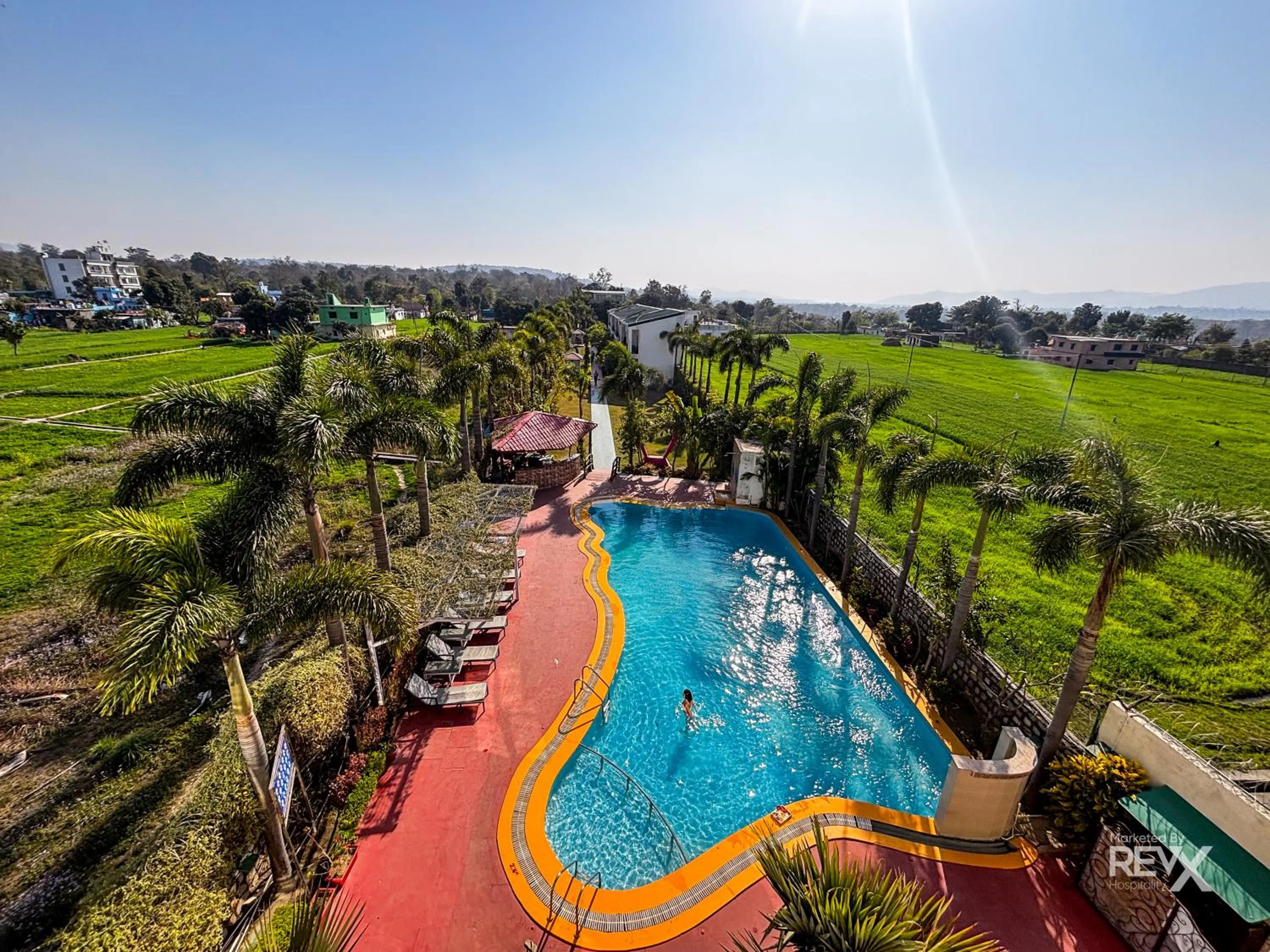Swimming pool in The Neeraj River Forest Resort Ayurvedic Wellness Center