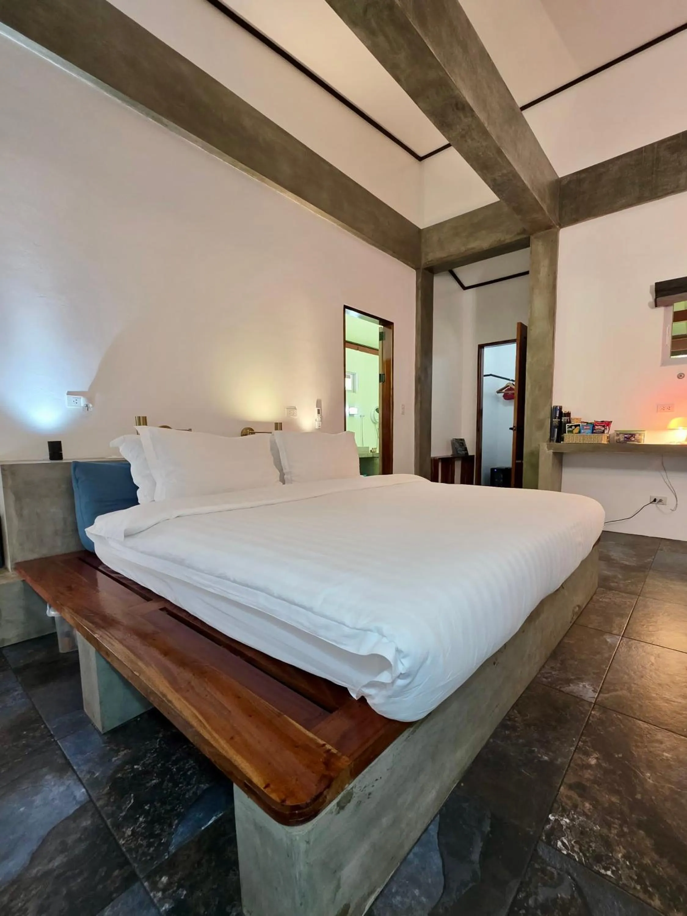 Bed in SomeWhere Else Boutique Resort