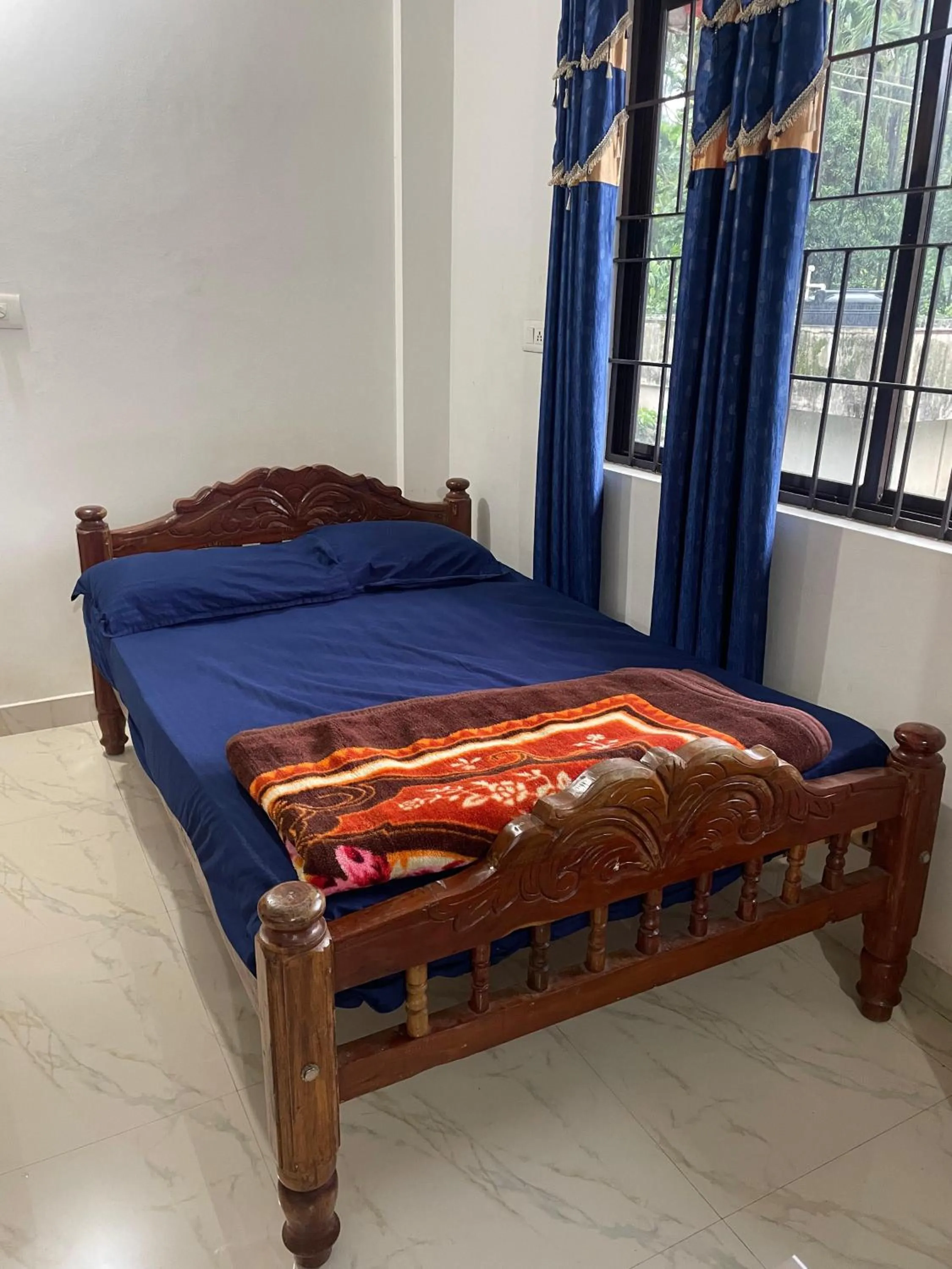 Bed in Nisarga Homestay