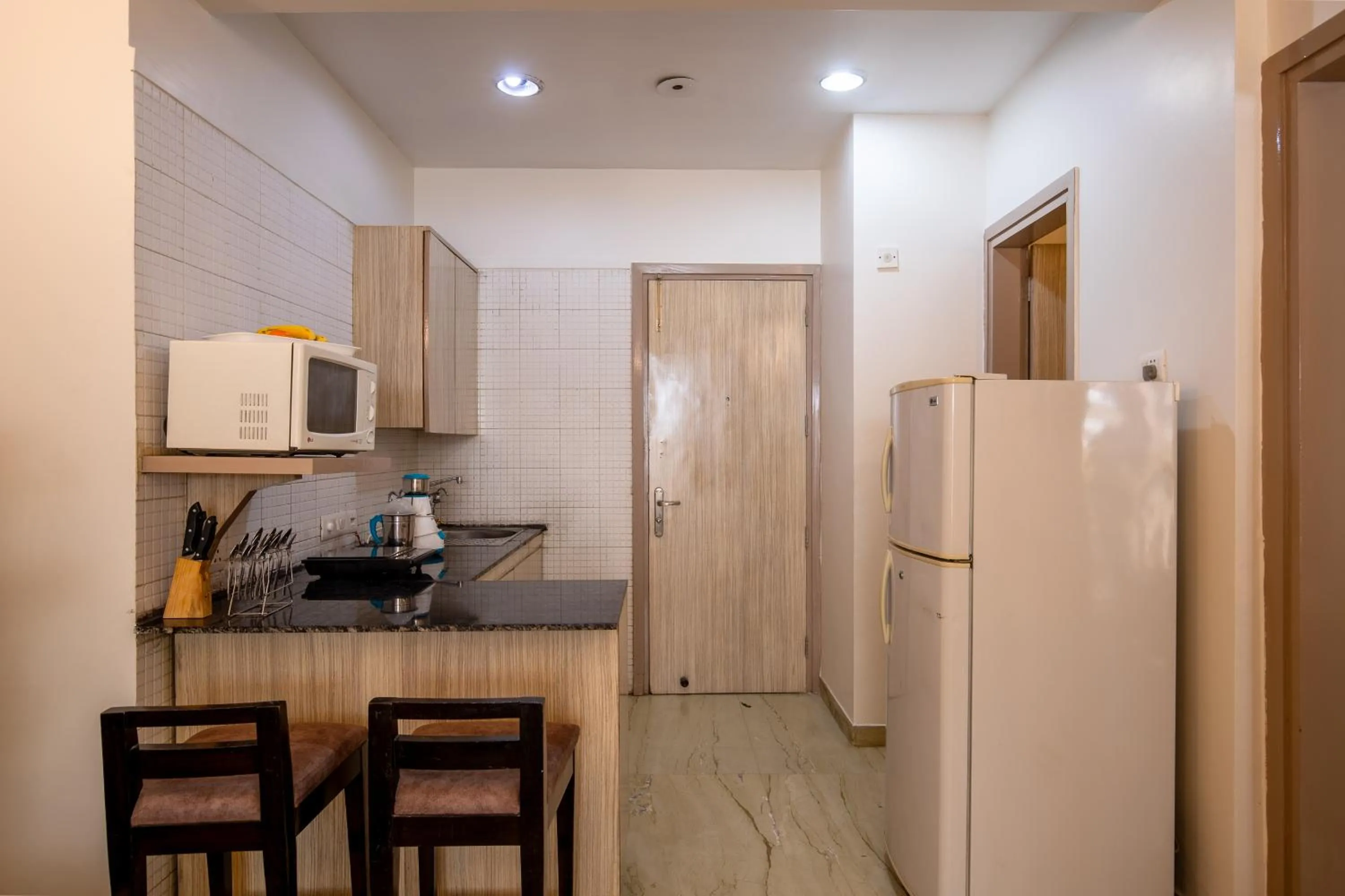 Kitchen or kitchenette in BedChambers Serviced Apartments, Sector 40