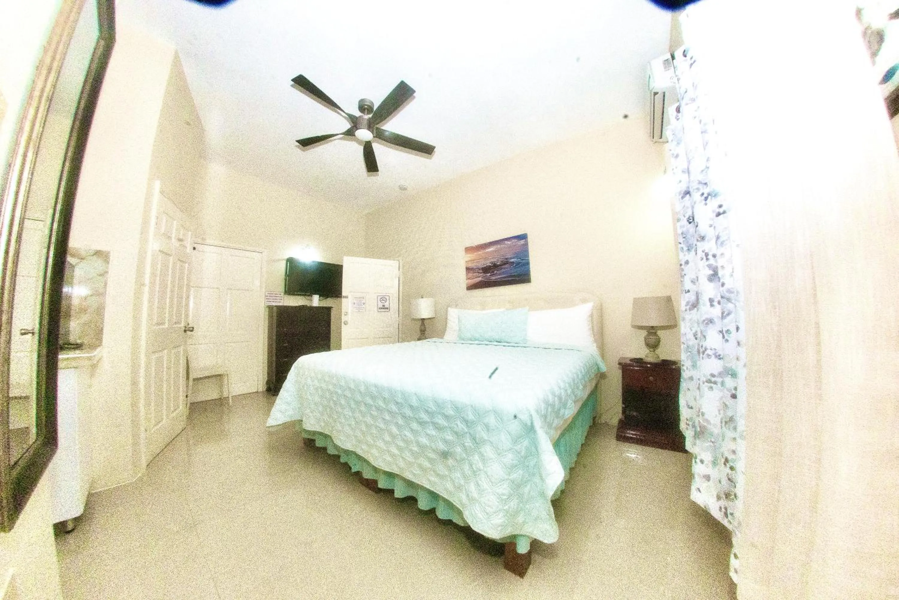 Bed in Dela de-Rose Guest House Negril Jamaica