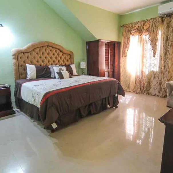 Bed in Dela de-Rose Guest House Negril Jamaica