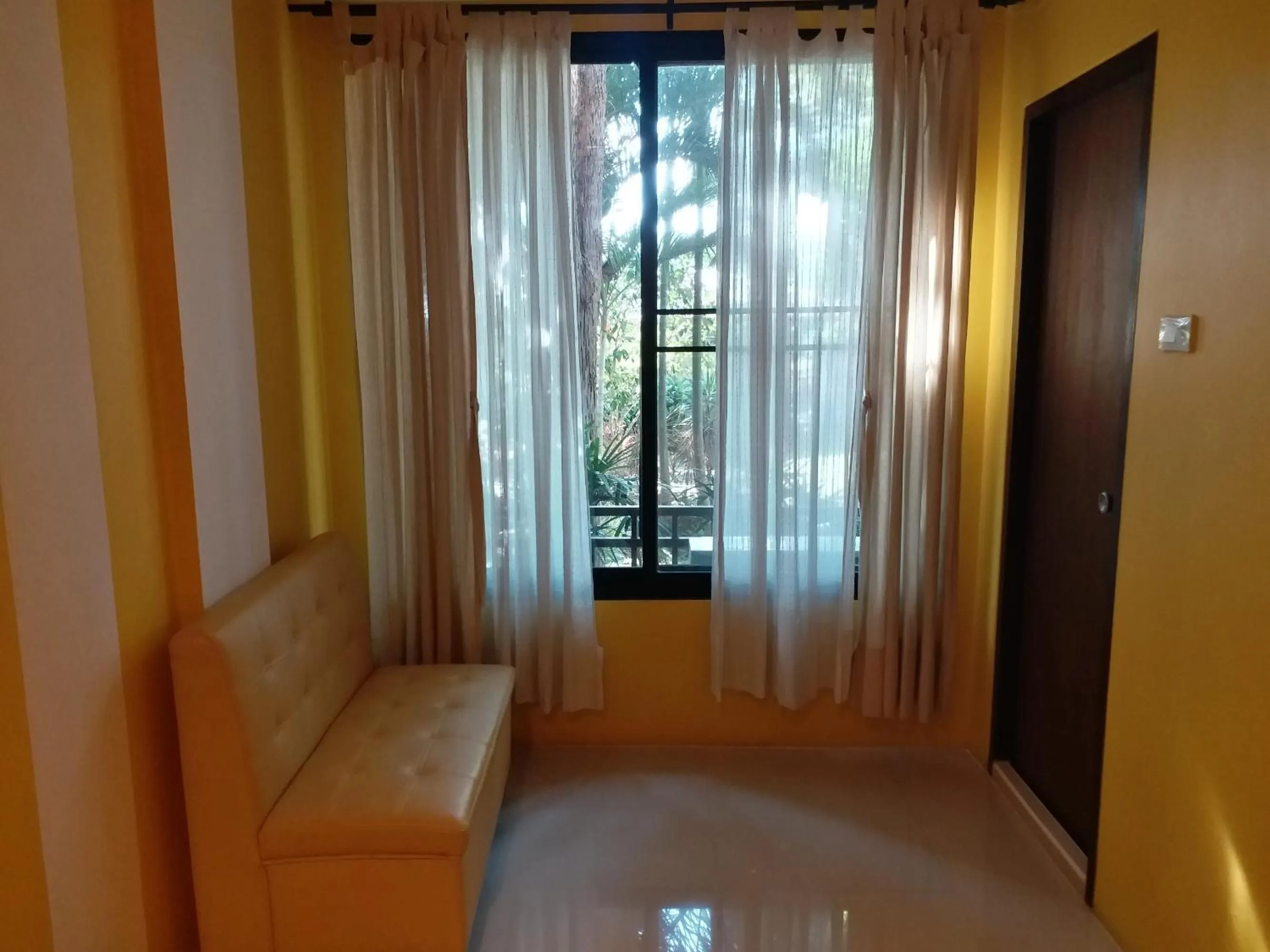 Seating area, Bed in Sand Paisan Resort