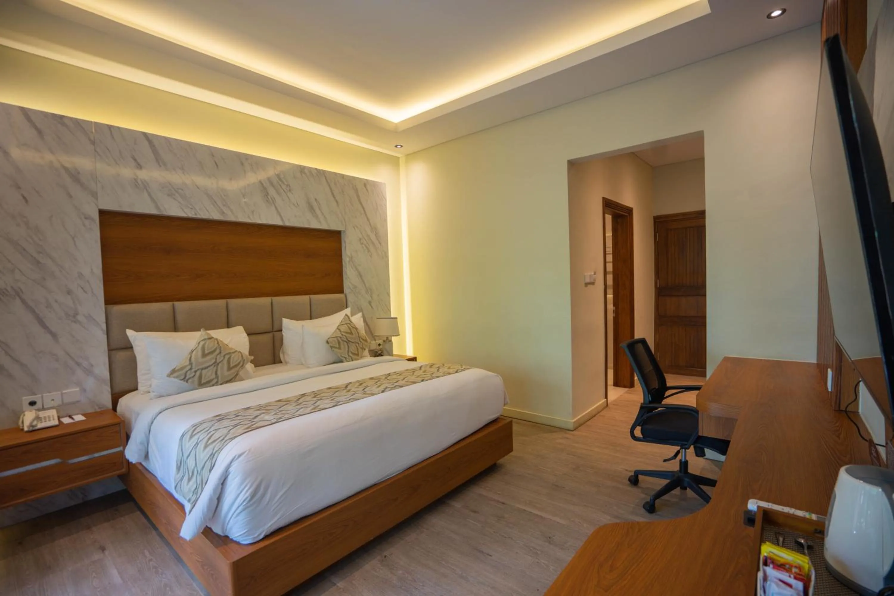 Bed in The Grand Villandra Resort Lovina