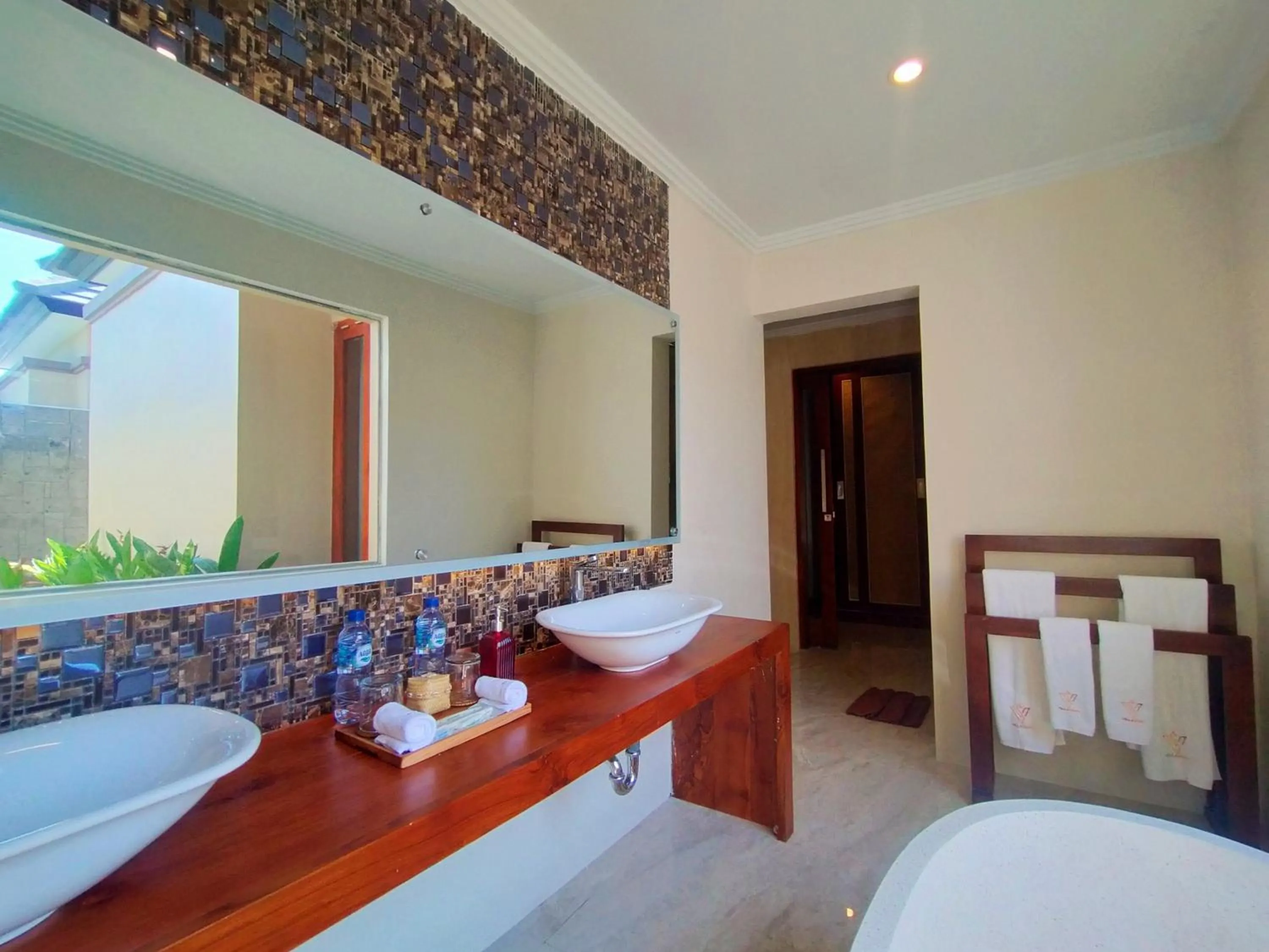 Bathroom, Bed in The Grand Villandra Resort Lovina