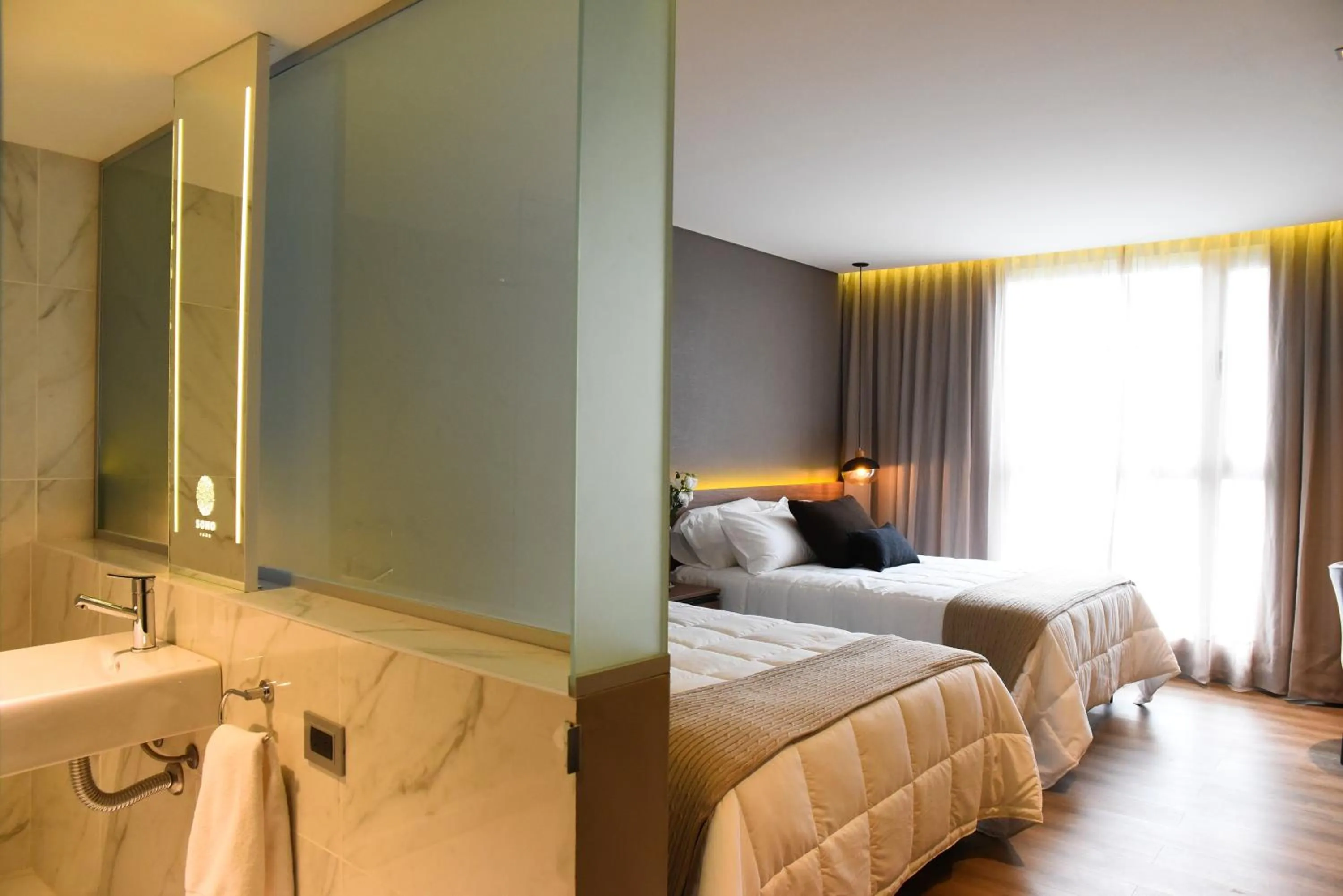 Photo of the whole room, Bed in Hotel Soho Suites