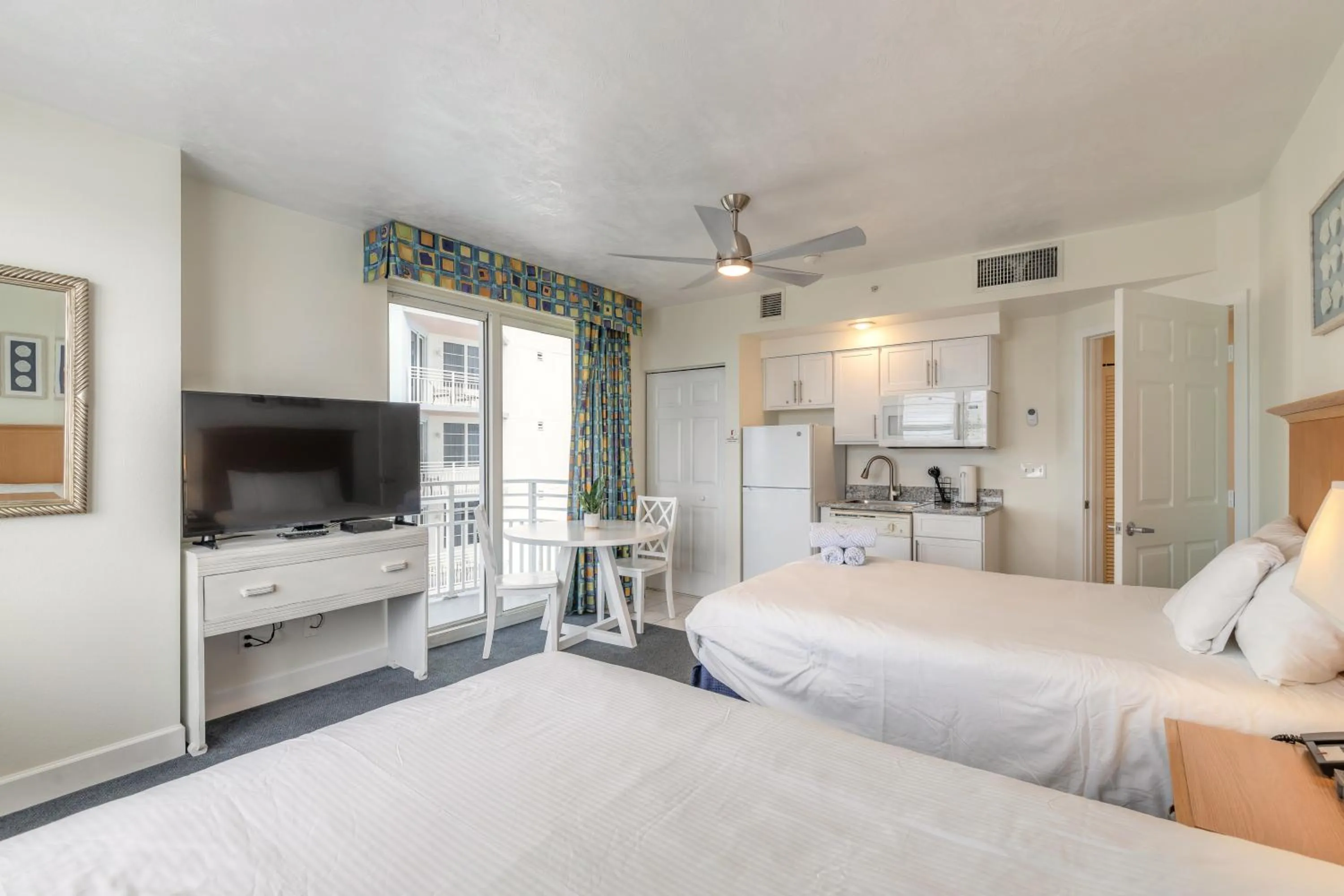 Kitchen or kitchenette, Bed in Beachfront Bliss at Ocean Walk Resort - Unit 1701