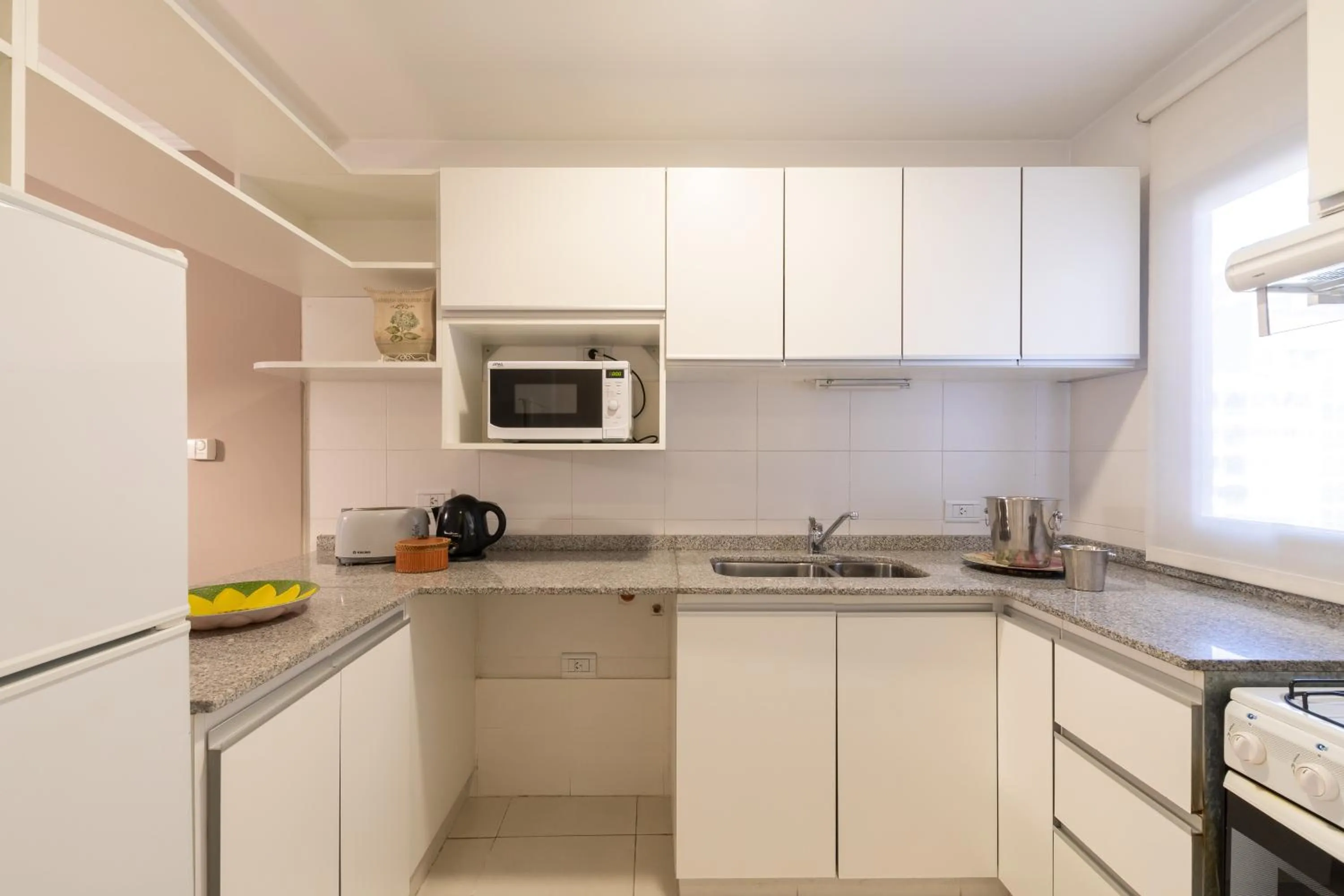 Kitchen or kitchenette in AT Suites