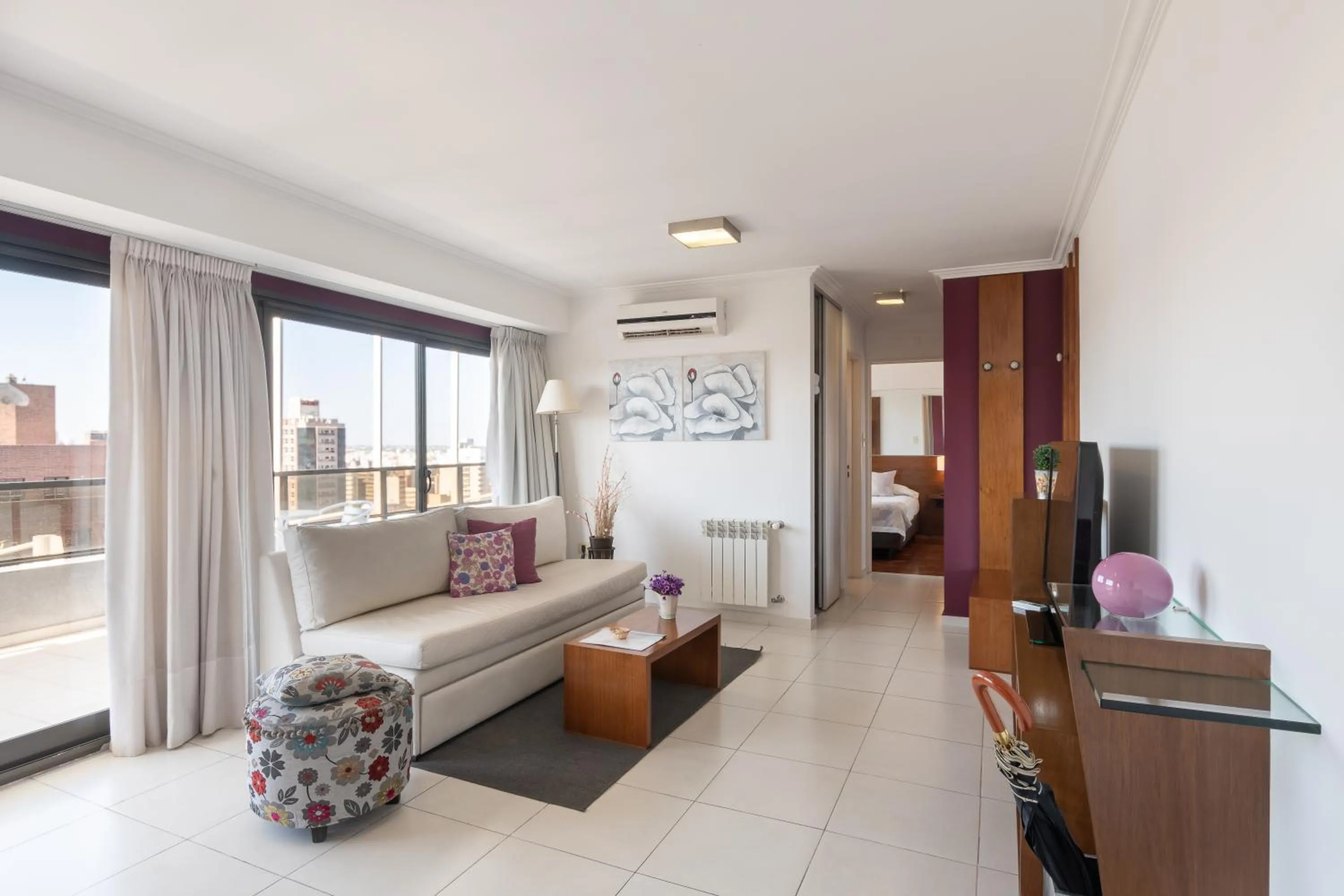 Living room, Bed in AT Suites