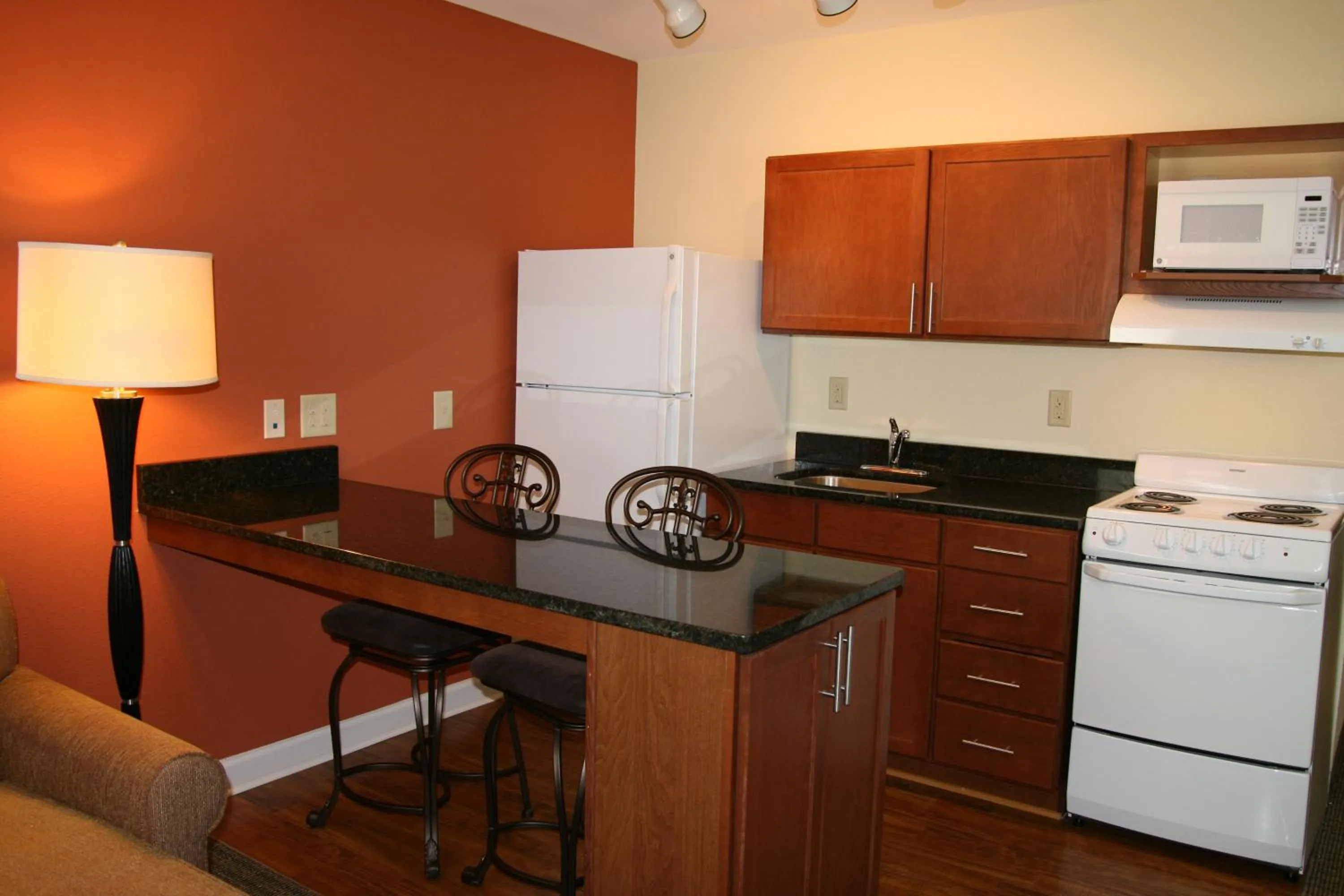 Kitchen or kitchenette in Affordable Suites - Fayetteville/Fort Bragg
