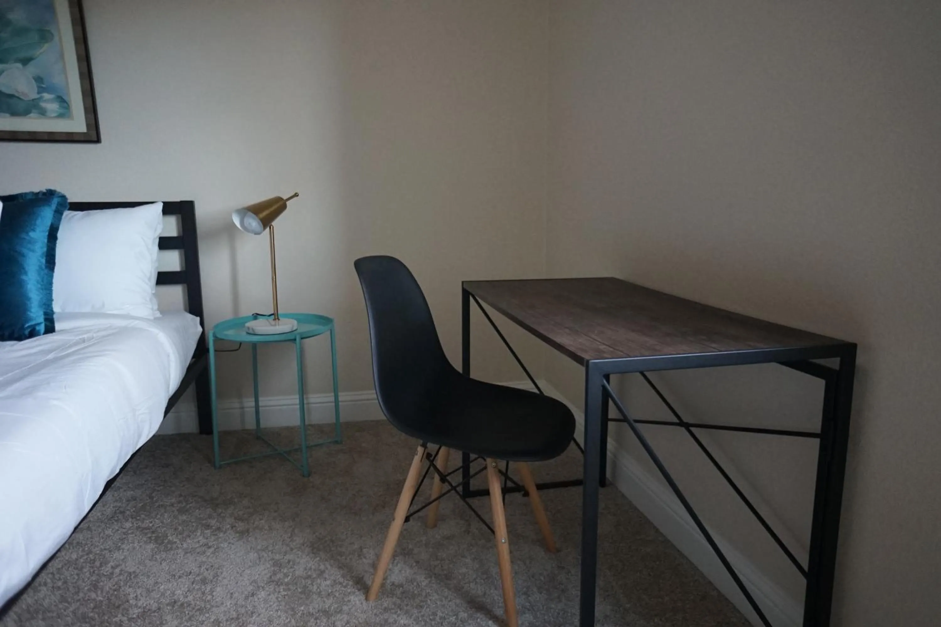 Seating area, Bed in Sleepover 1BD 1BA Oklahoma City Apartments