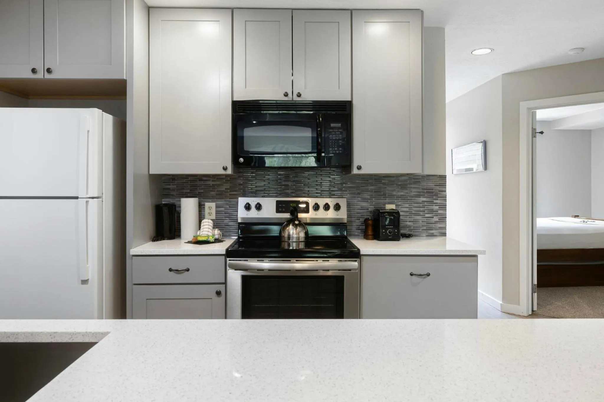 Communal kitchen in Evergreen Condominiums by Vail Resorts