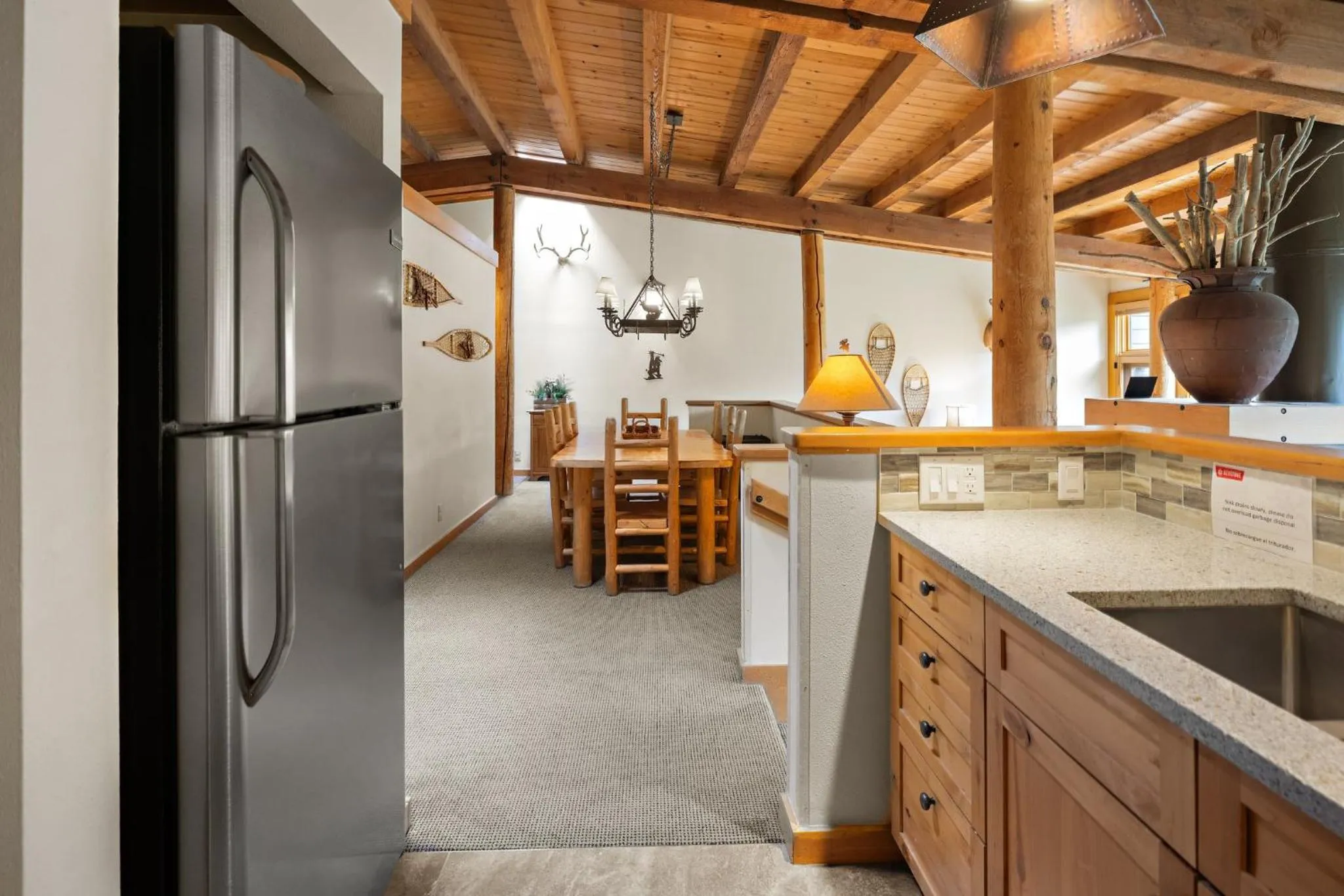 Communal kitchen in Evergreen Condominiums by Vail Resorts