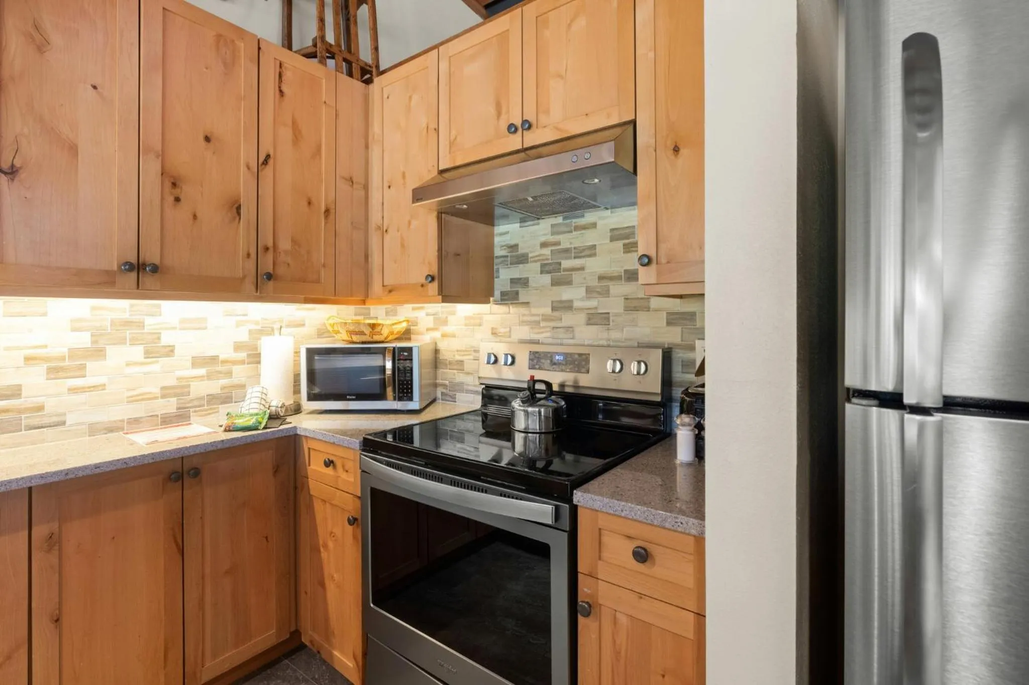 Communal kitchen in Evergreen Condominiums by Vail Resorts