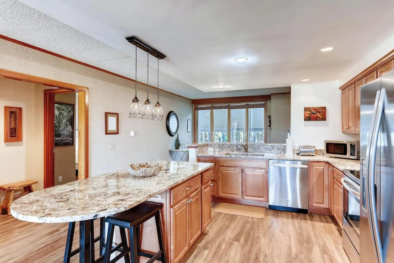 Communal kitchen in Evergreen Condominiums by Vail Resorts