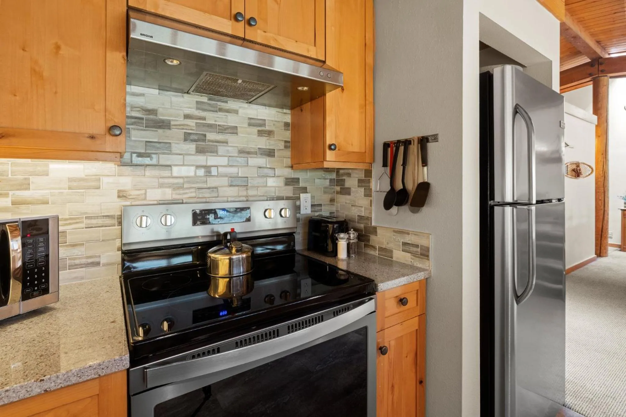 Communal kitchen in Evergreen Condominiums by Vail Resorts