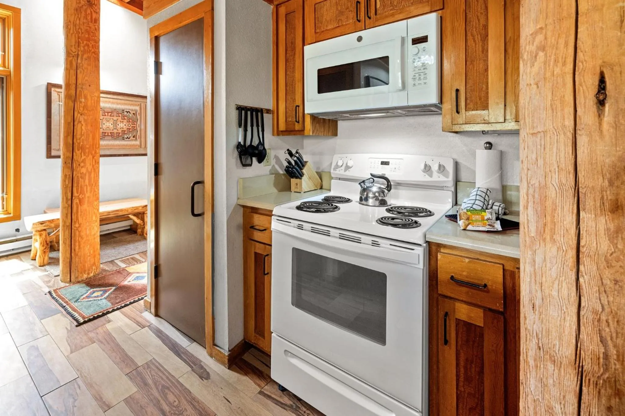 Communal kitchen in Evergreen Condominiums by Vail Resorts