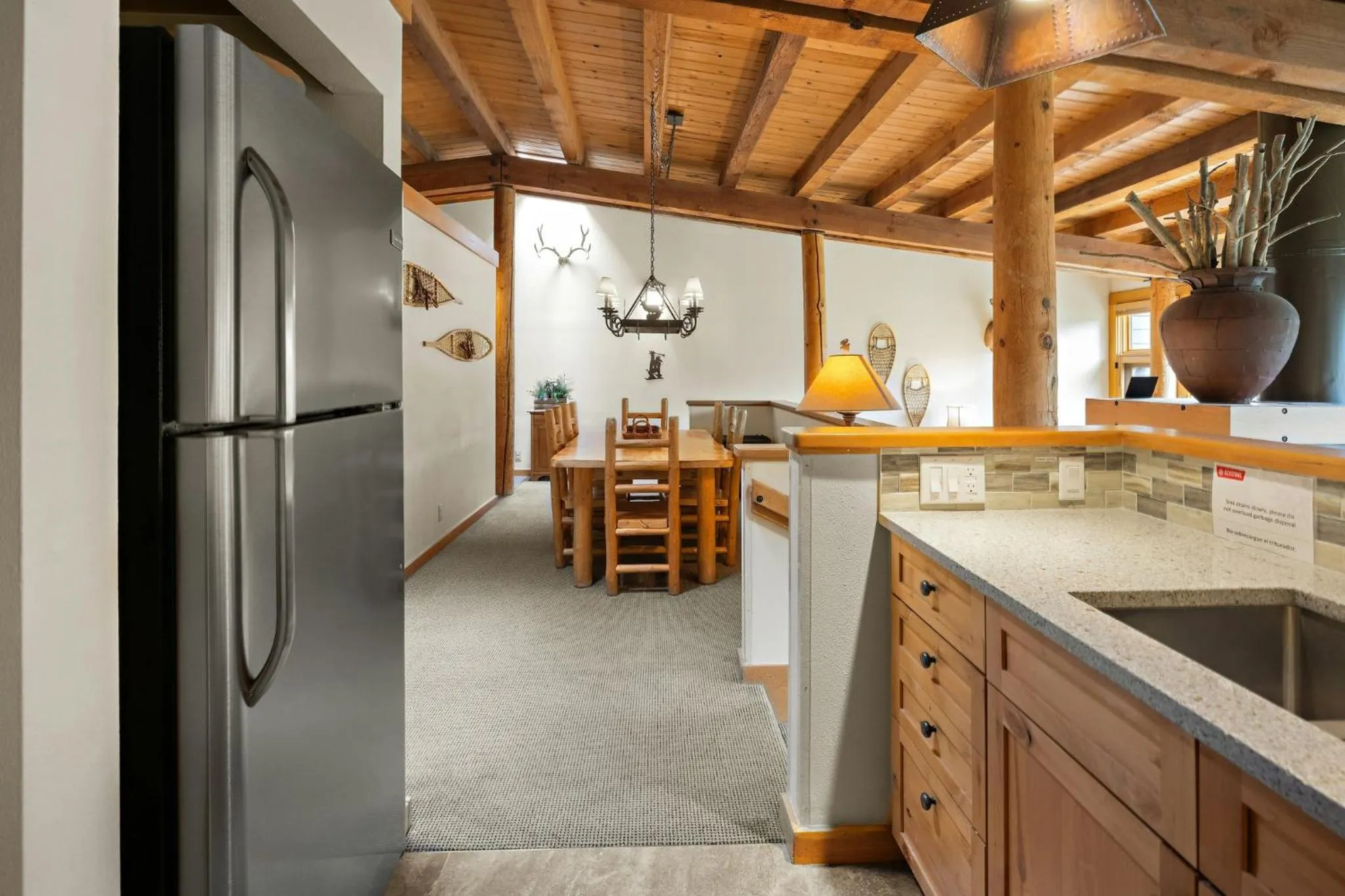 Communal kitchen in Evergreen Condominiums by Vail Resorts